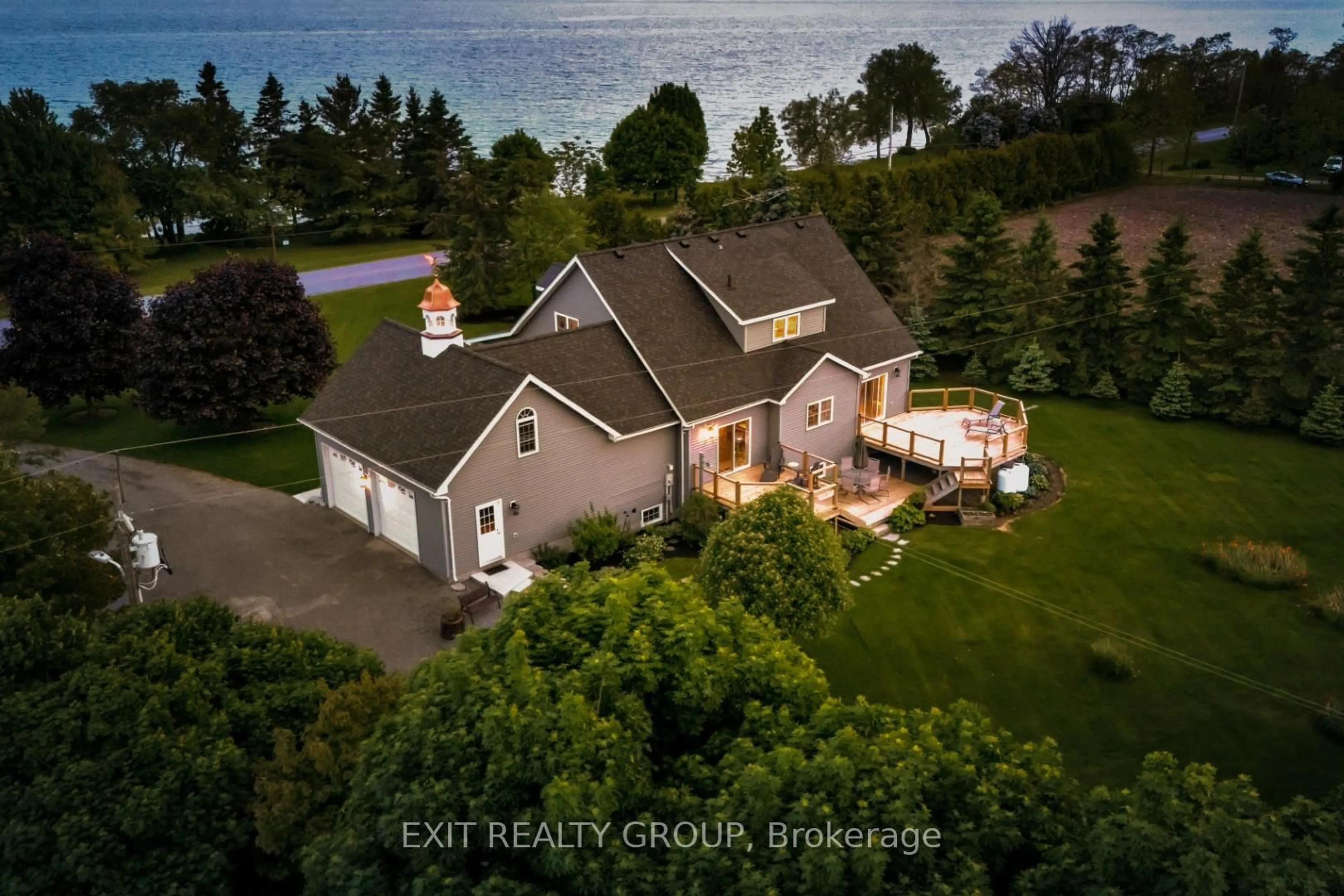 A pic from outside/outdoor area/front of a property/back of a property/a pic from drone, water/lake/river/ocean view for 830 County Rd 20, Prince Edward County Ontario K0K 3L0