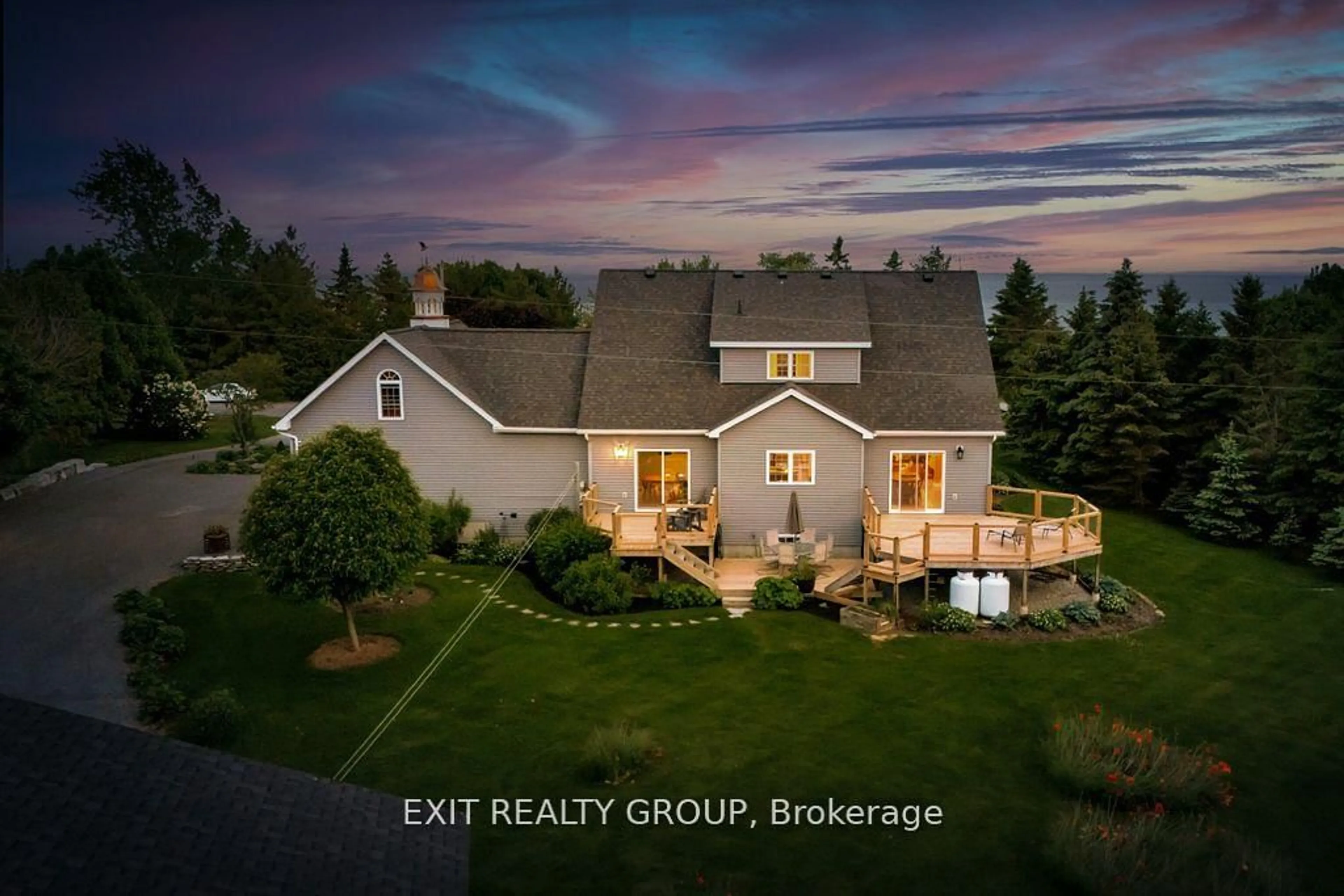 A pic from outside/outdoor area/front of a property/back of a property/a pic from drone, water/lake/river/ocean view for 830 County Rd 20, Prince Edward County Ontario K0K 3L0