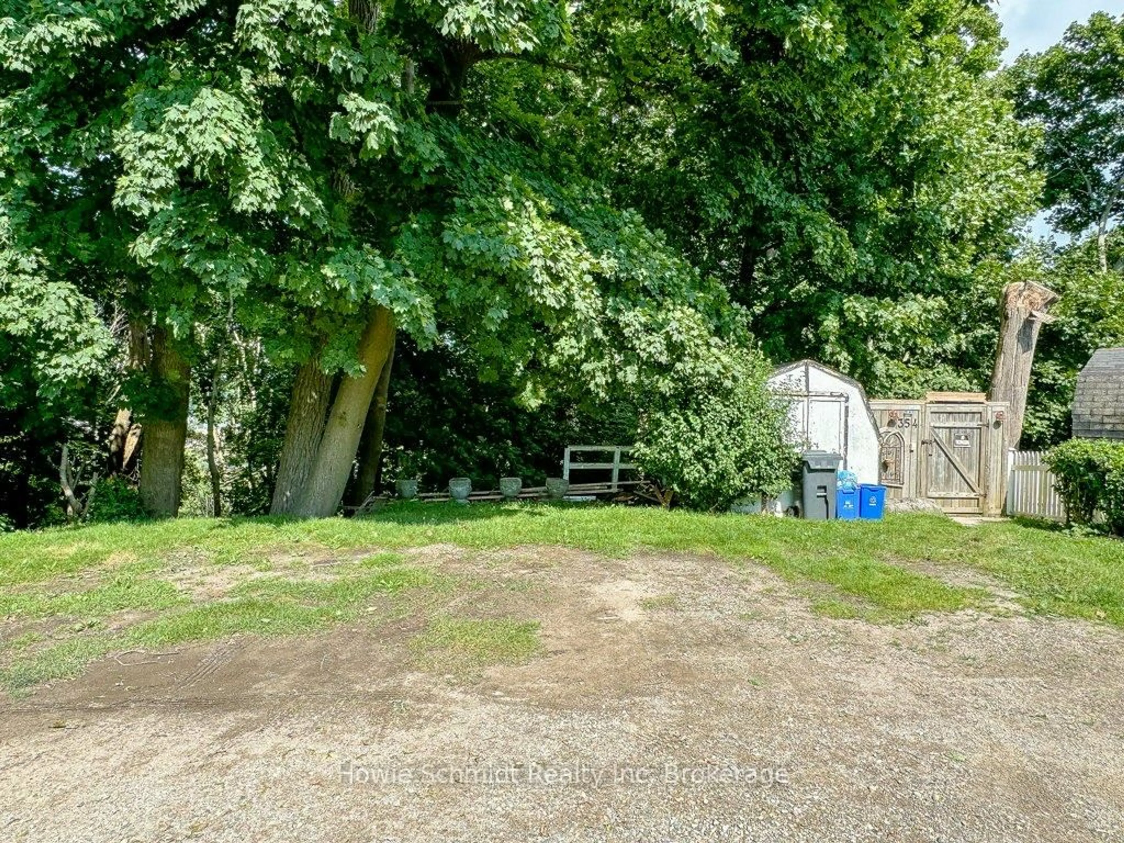 A pic from outside/outdoor area/front of a property/back of a property/a pic from drone, forest/trees view for 354 Erie St, Central Elgin Ontario N5L 1E9