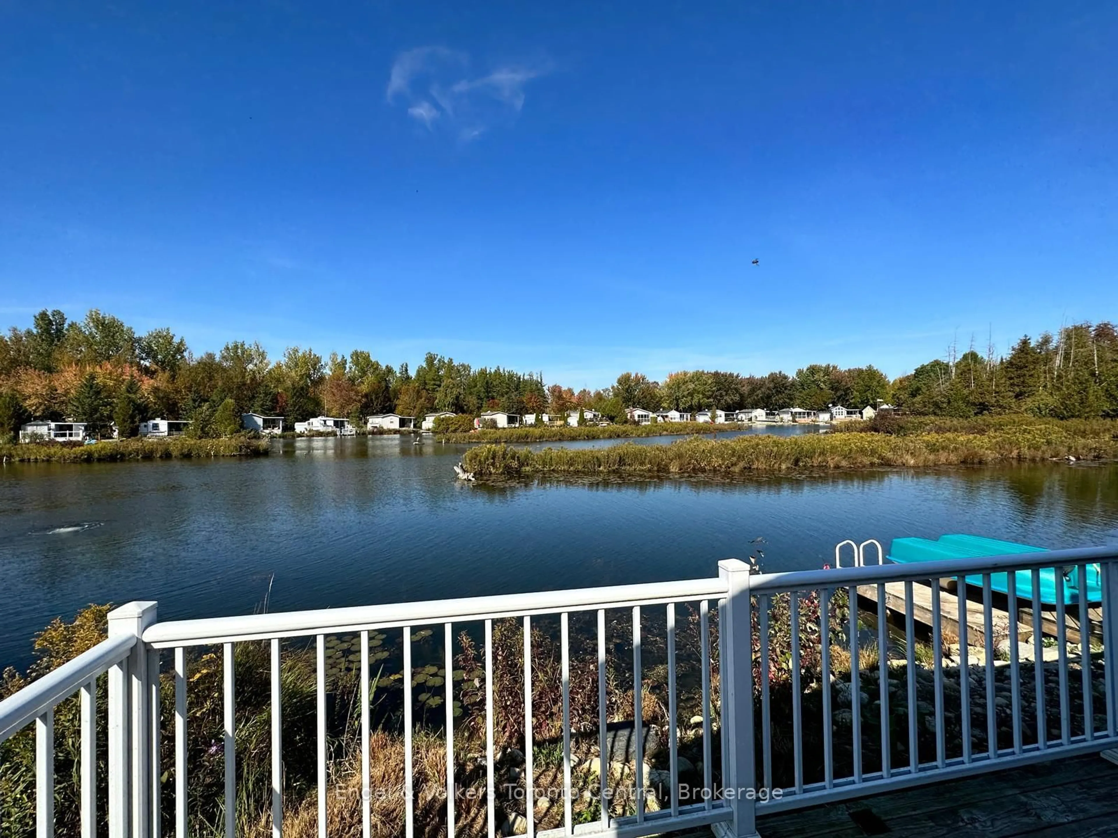 A pic from outside/outdoor area/front of a property/back of a property/a pic from drone, water/lake/river/ocean view for 7489 SIDEROAD 5 #T103, Wellington North Ontario N0G 2L0