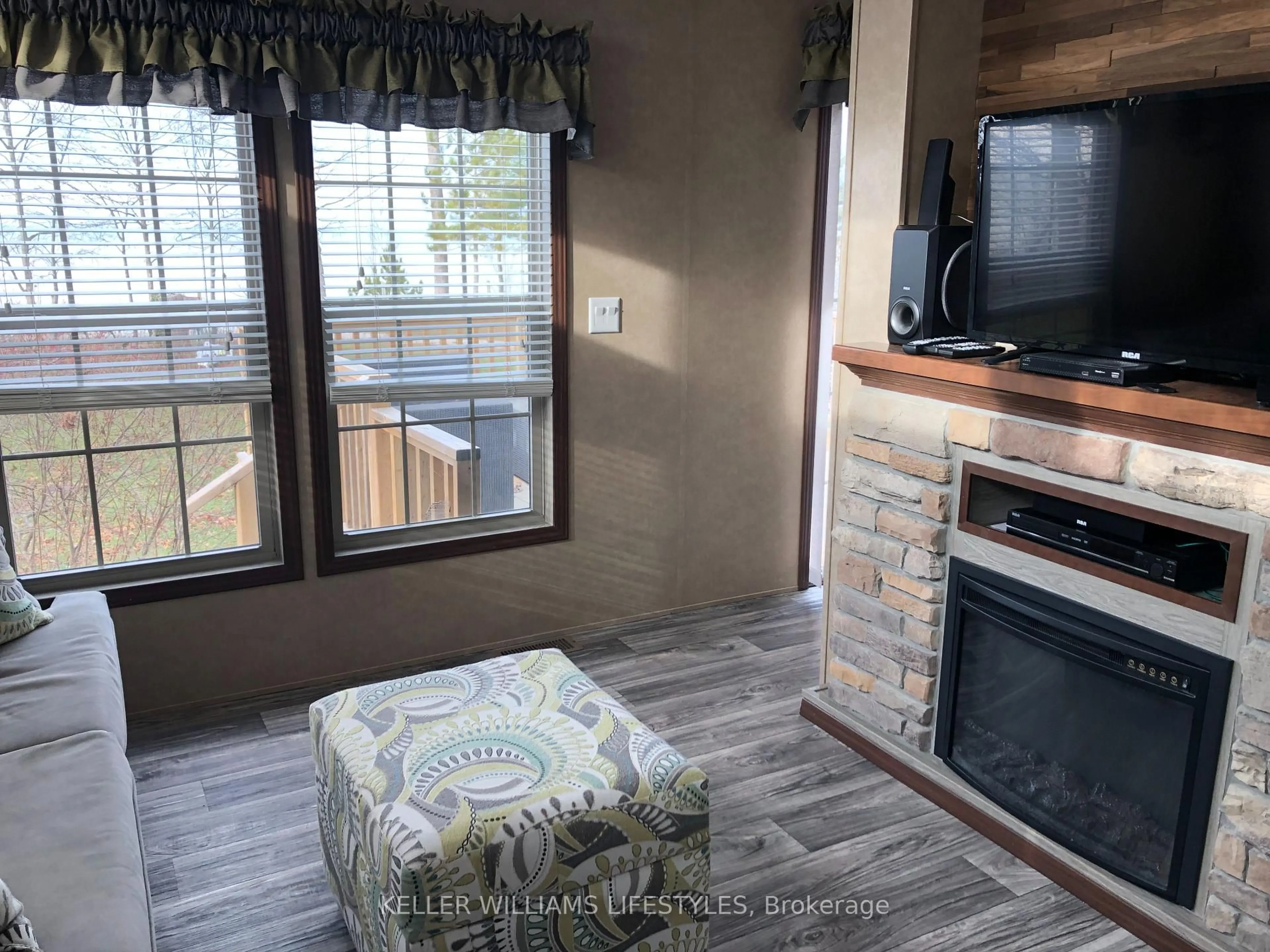 Living room with furniture, wood/laminate floor for 77719 Bluewater Highway #4, Bluewater Ontario N0M 1G0