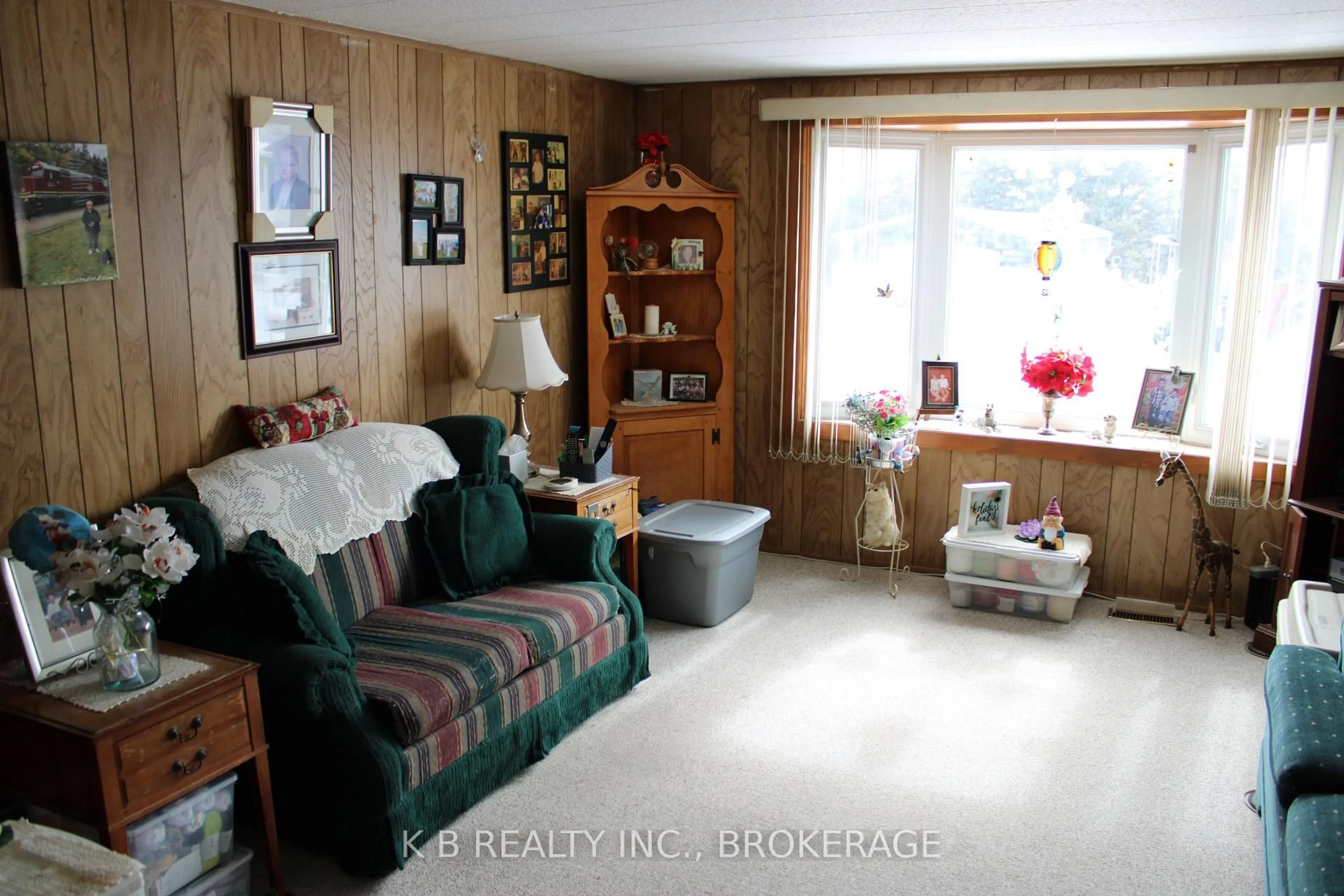 Living room with furniture, wood/laminate floor for 6 Cedar St, Greater Napanee Ontario K7R 3L1
