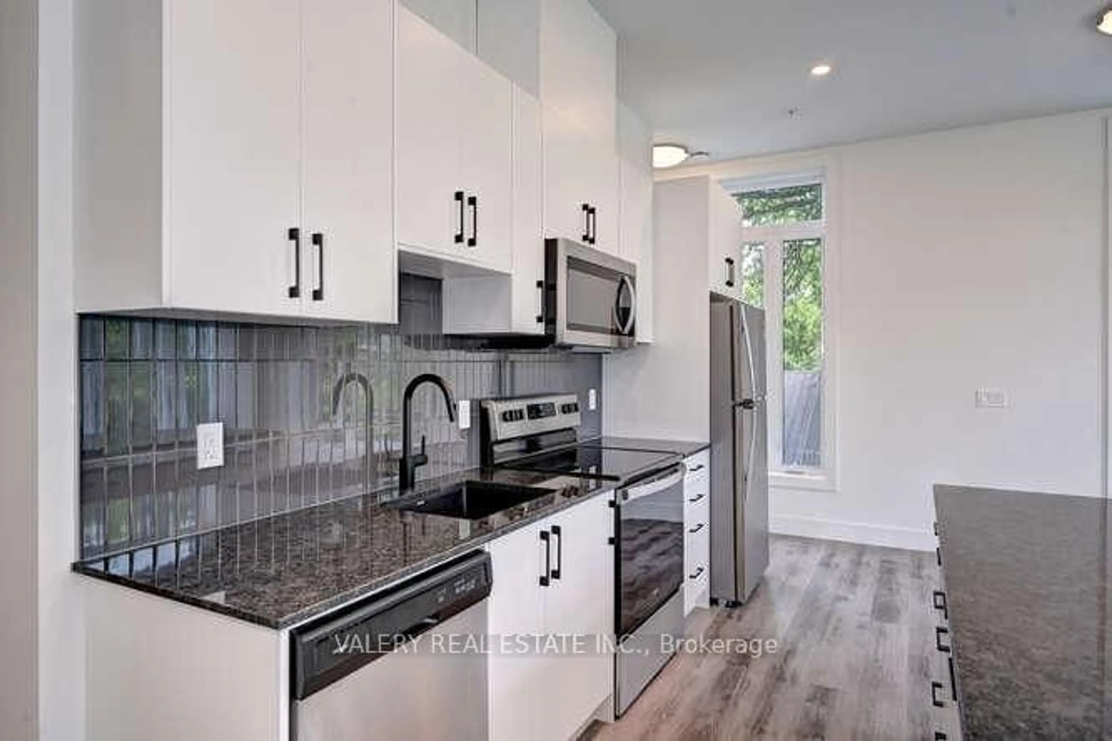 Open concept kitchen, ceramic/tile floor for 103 Roger St #102, Waterloo Ontario N2J 1A4