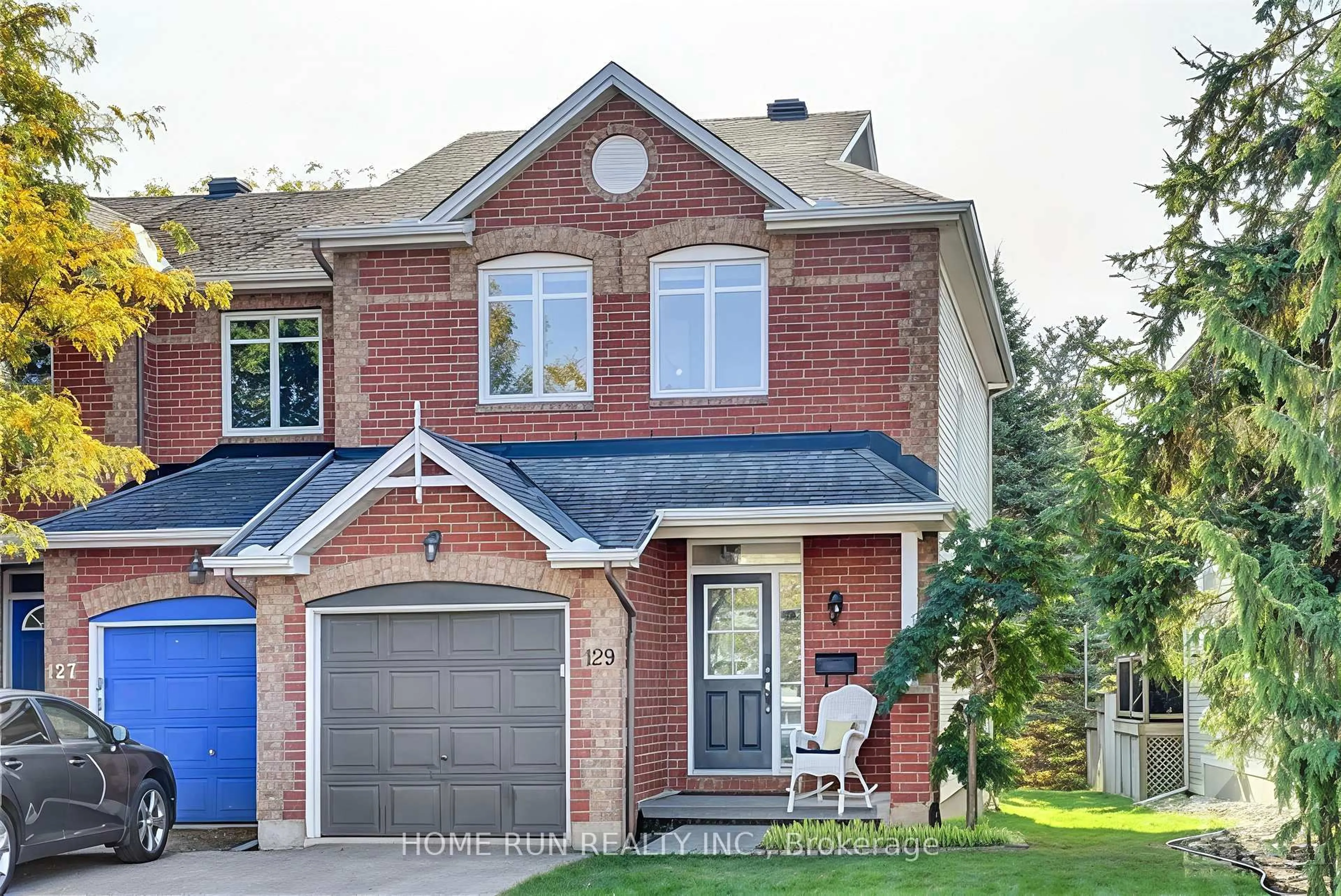 Home with brick exterior material, street for 129 Hearst Way, Ottawa Ontario K2L 4G5