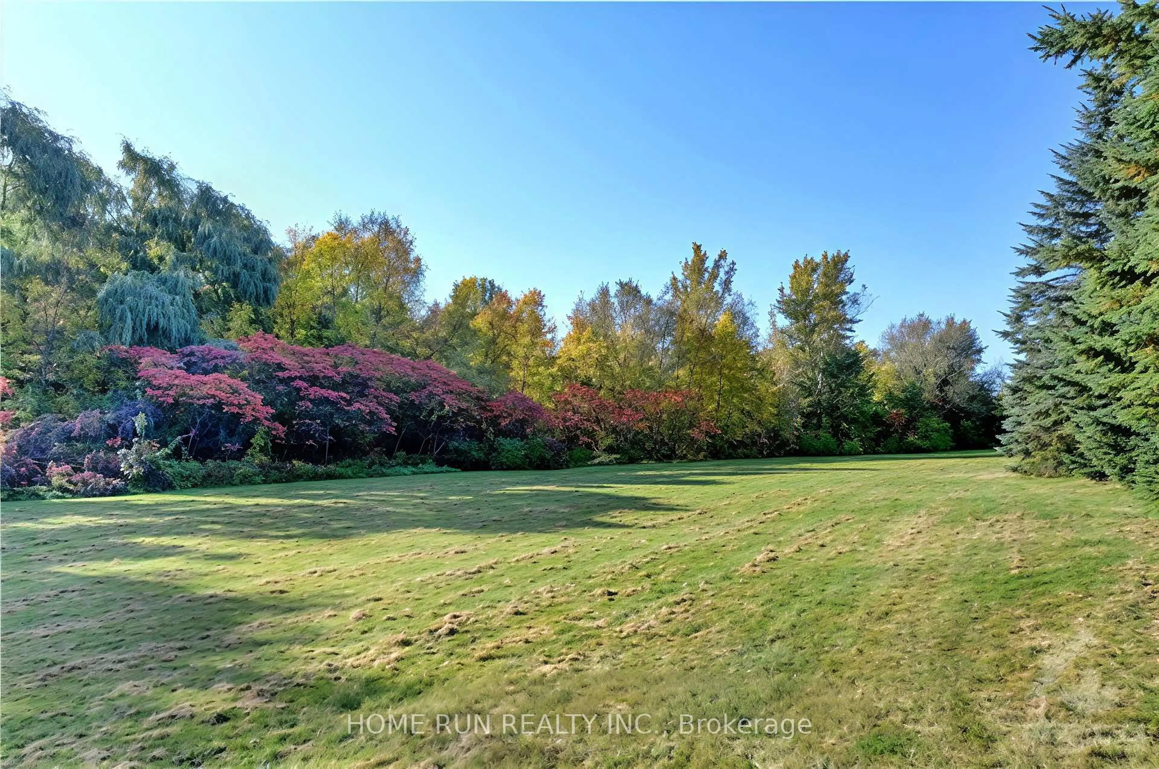 A pic from outside/outdoor area/front of a property/back of a property/a pic from drone, forest/trees view for 129 Hearst Way, Ottawa Ontario K2L 4G5