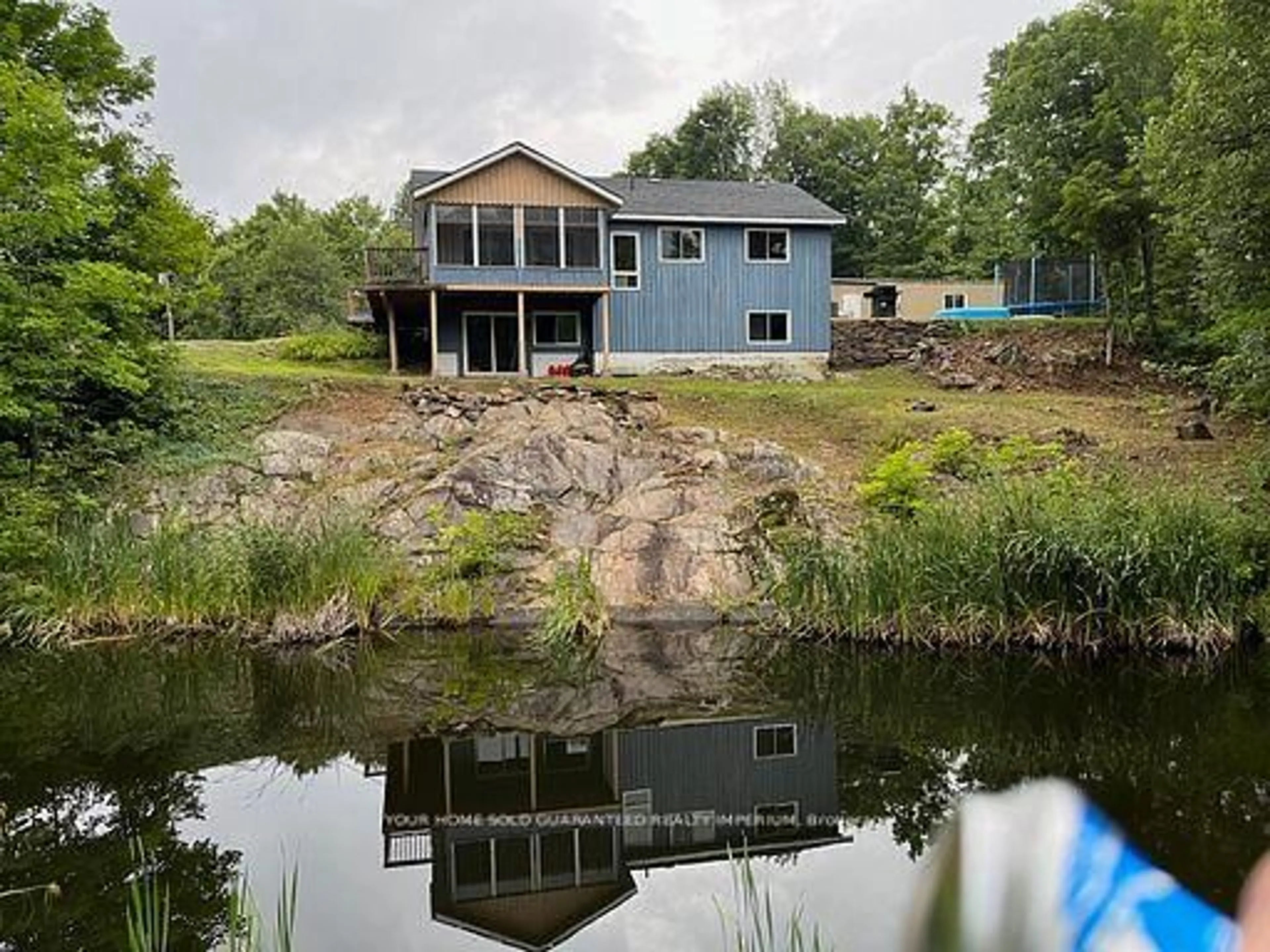 A pic from outside/outdoor area/front of a property/back of a property/a pic from drone, water/lake/river/ocean view for 1603 BALMER Rd, North Kawartha Ontario K0L 1A0