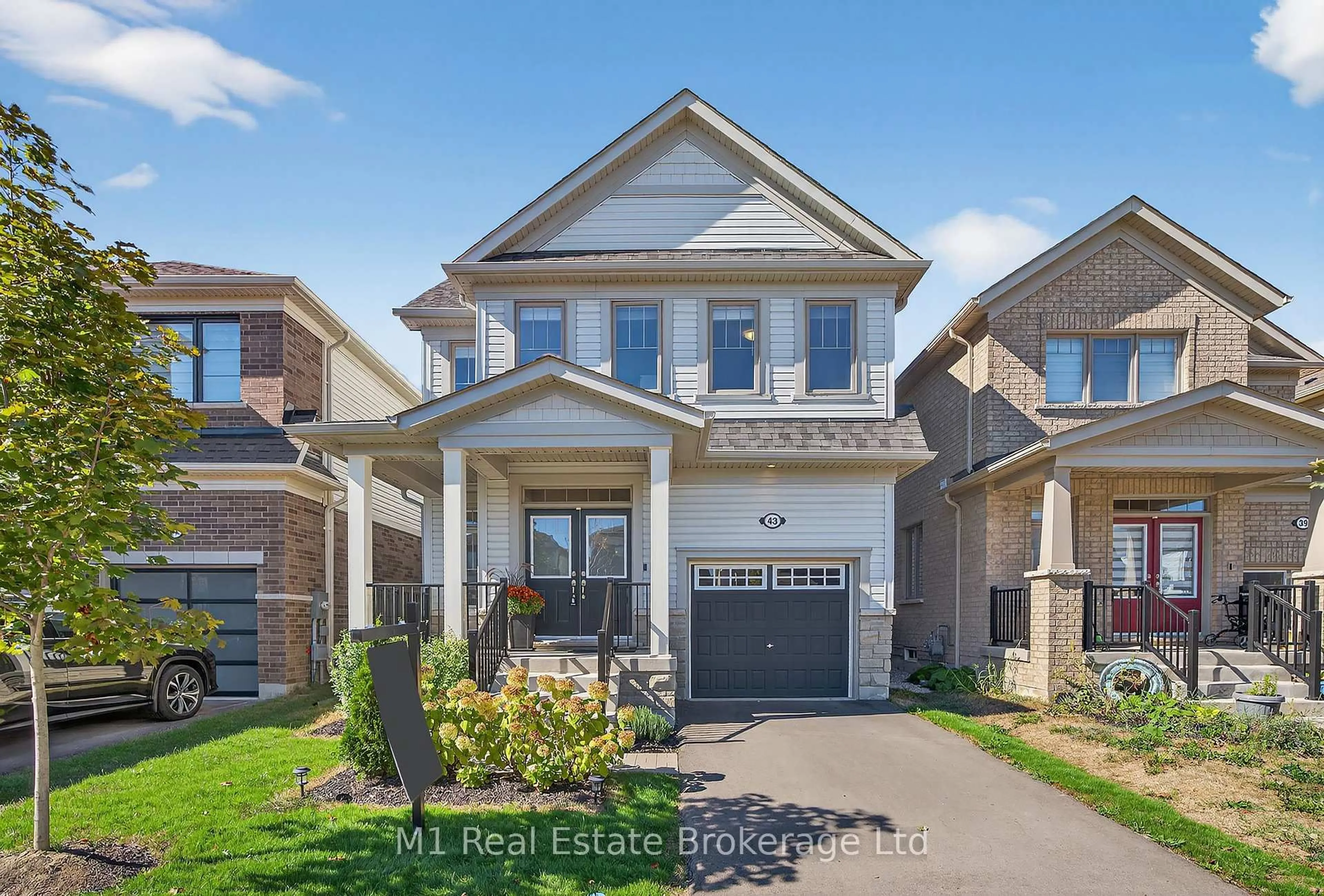 Home with brick exterior material, street for 43 Harpin Way, Centre Wellington Ontario N1M 0H7