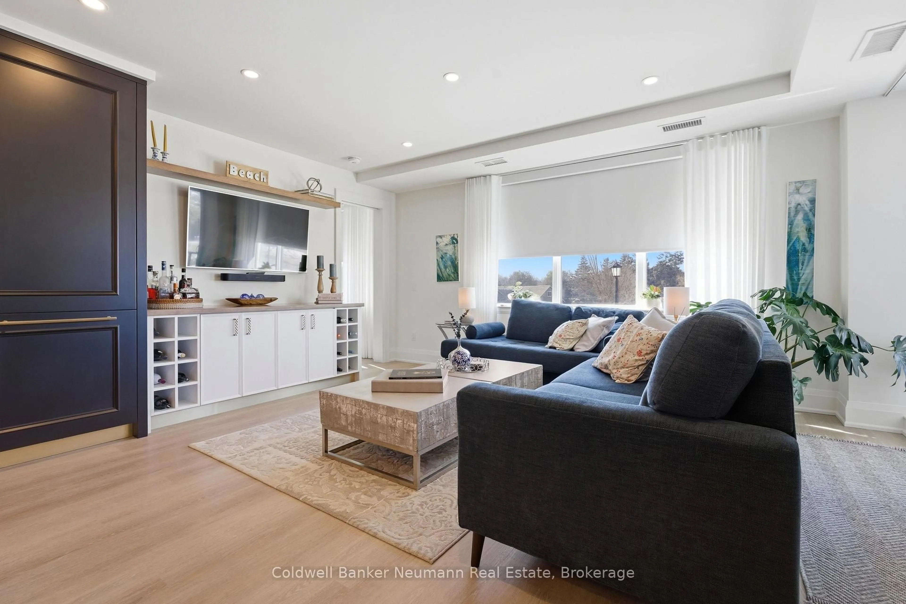 Living room with furniture, wood/laminate floor for 6523 Wellington Road 7 Rd #213, Centre Wellington Ontario N0B 1S0