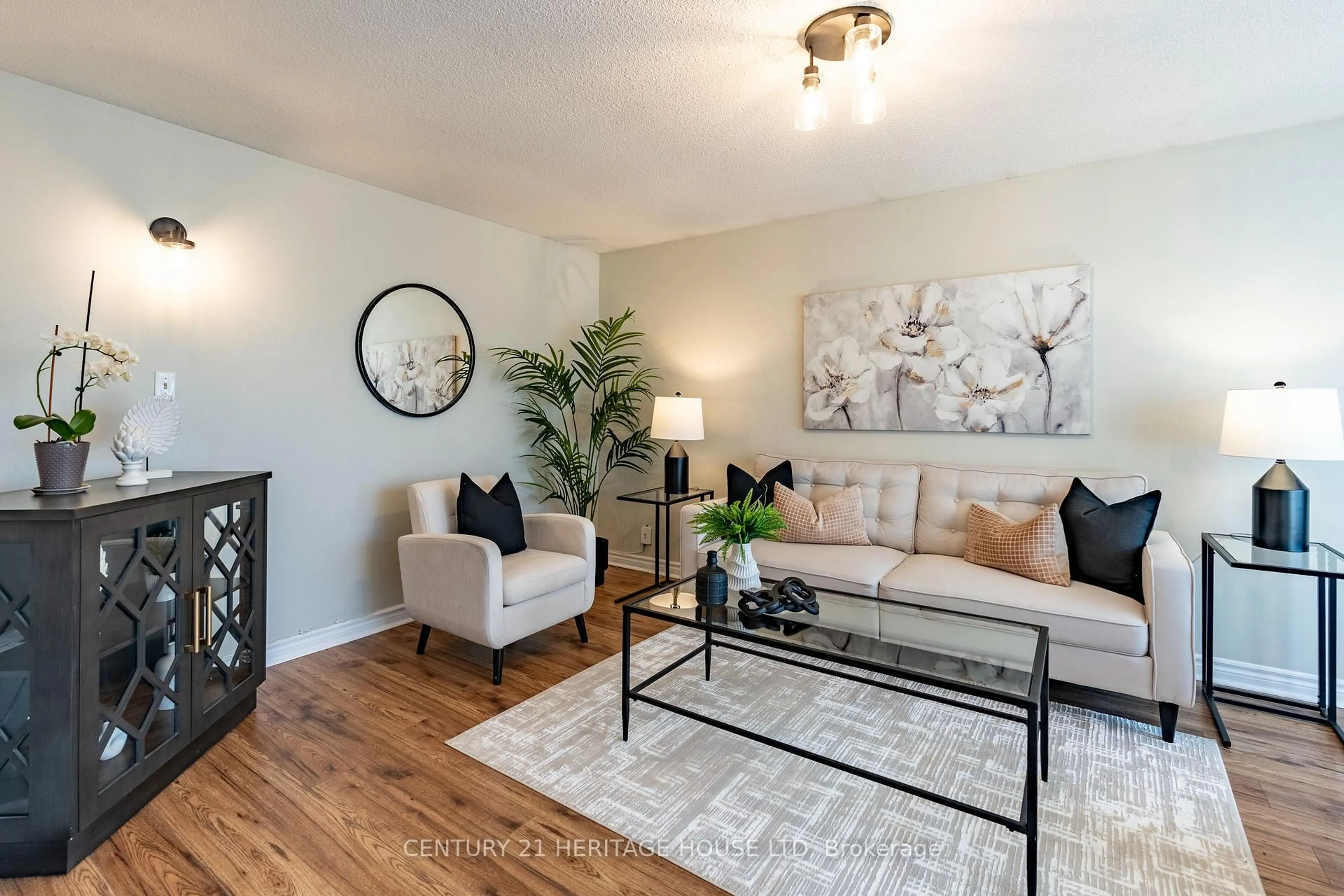 Living room with furniture, wood/laminate floor for 106 Hickory Heights Cres, Kitchener Ontario N2N 1H4