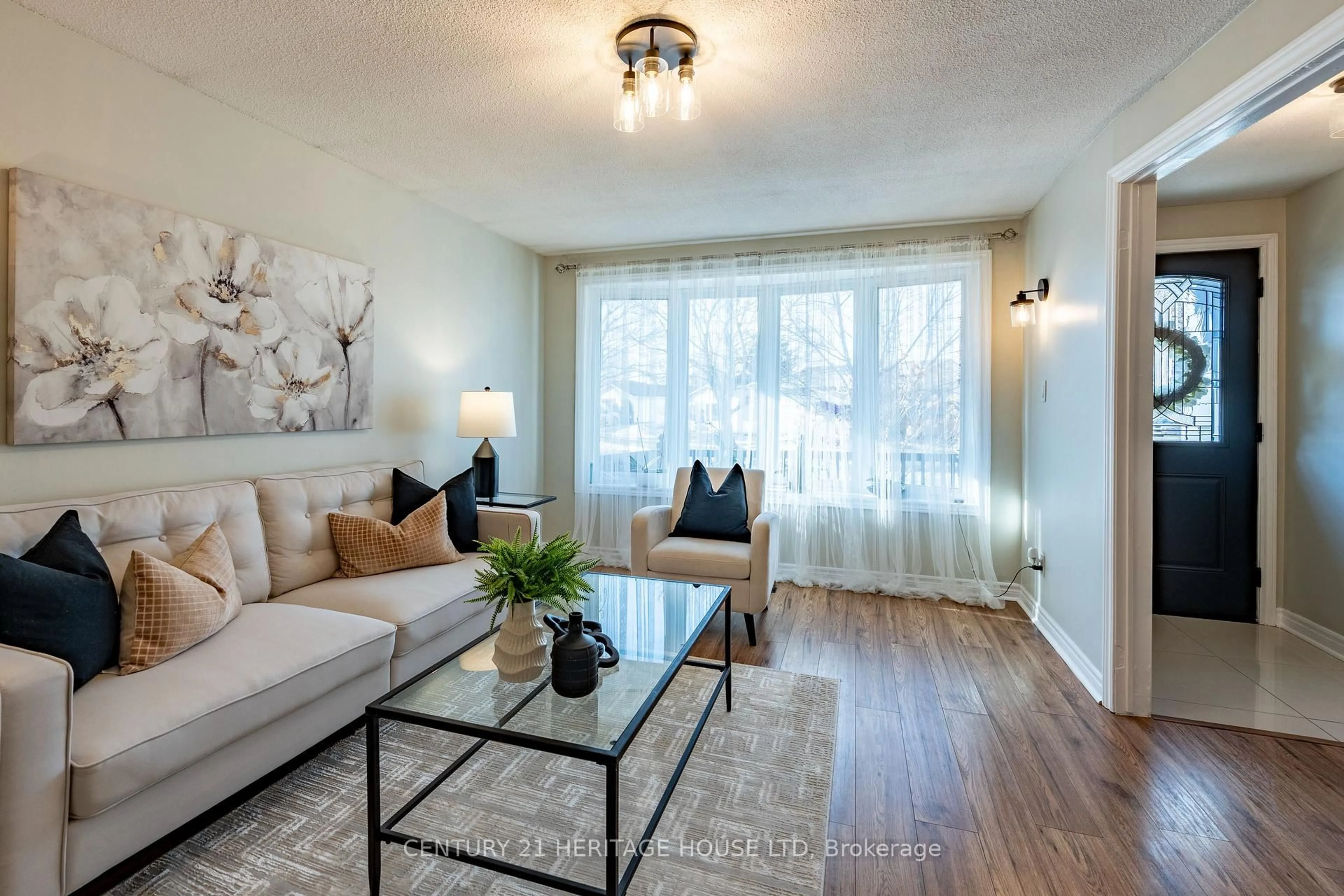 Living room with furniture, wood/laminate floor for 106 Hickory Heights Cres, Kitchener Ontario N2N 1H4
