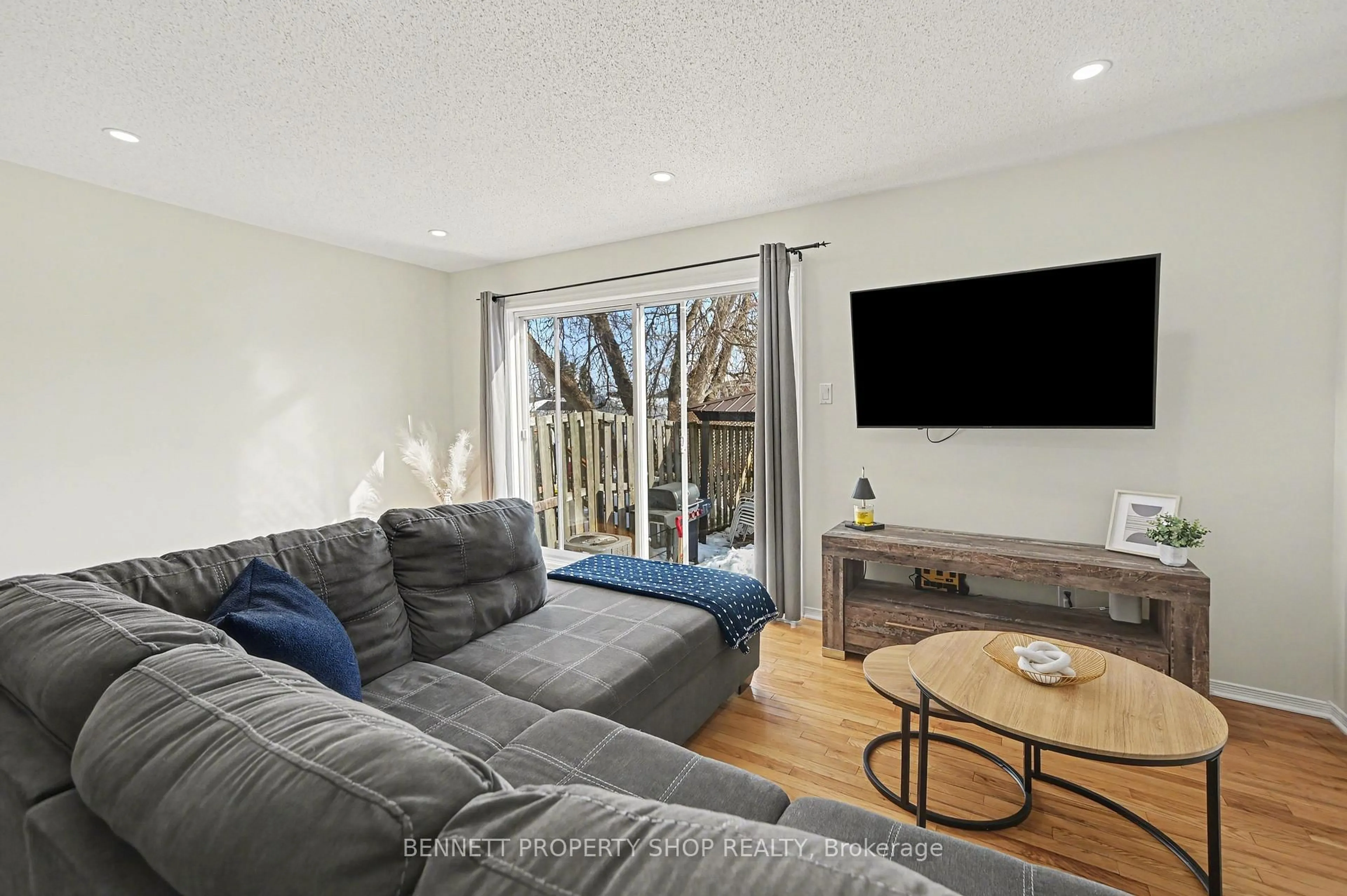 Living room with furniture, wood/laminate floor for 49 Forget St, Russell Ontario K0A 1W0