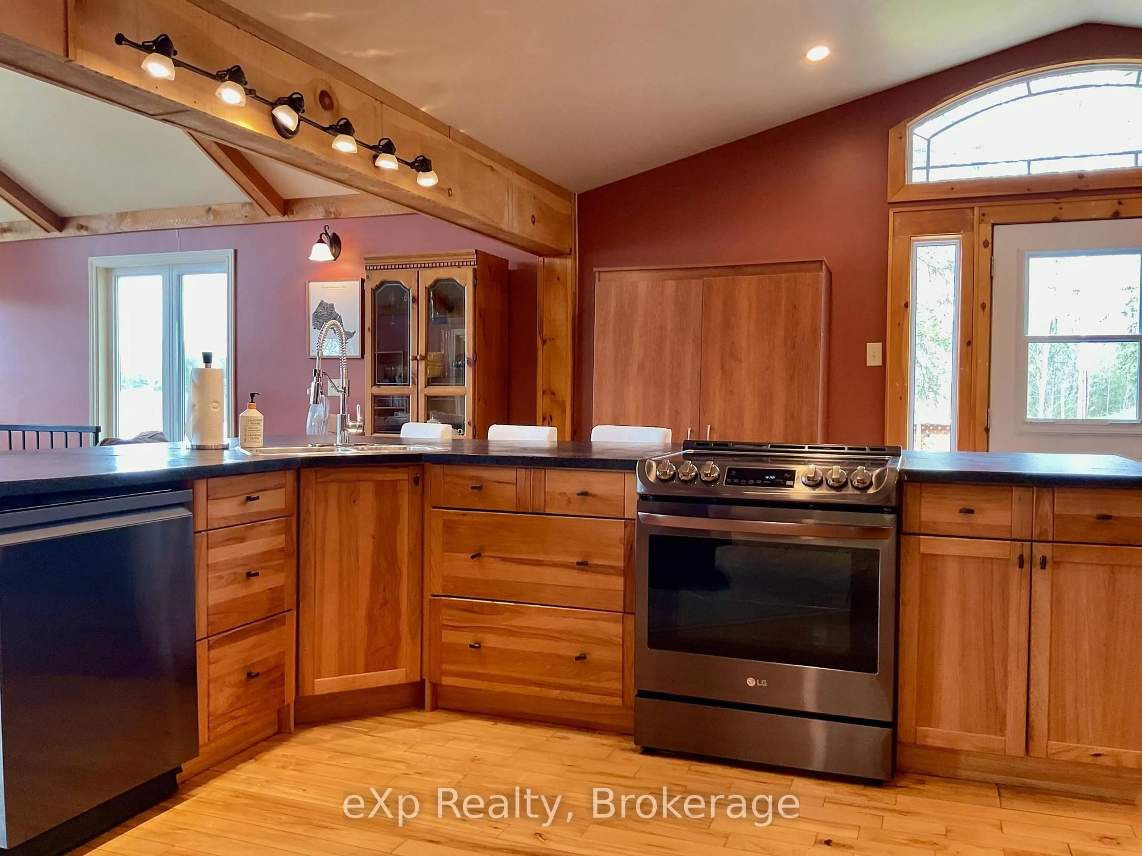 Open concept kitchen, wood/laminate floor for 19 Valley Dr, Parry Sound Remote Area Ontario P0H 1N0