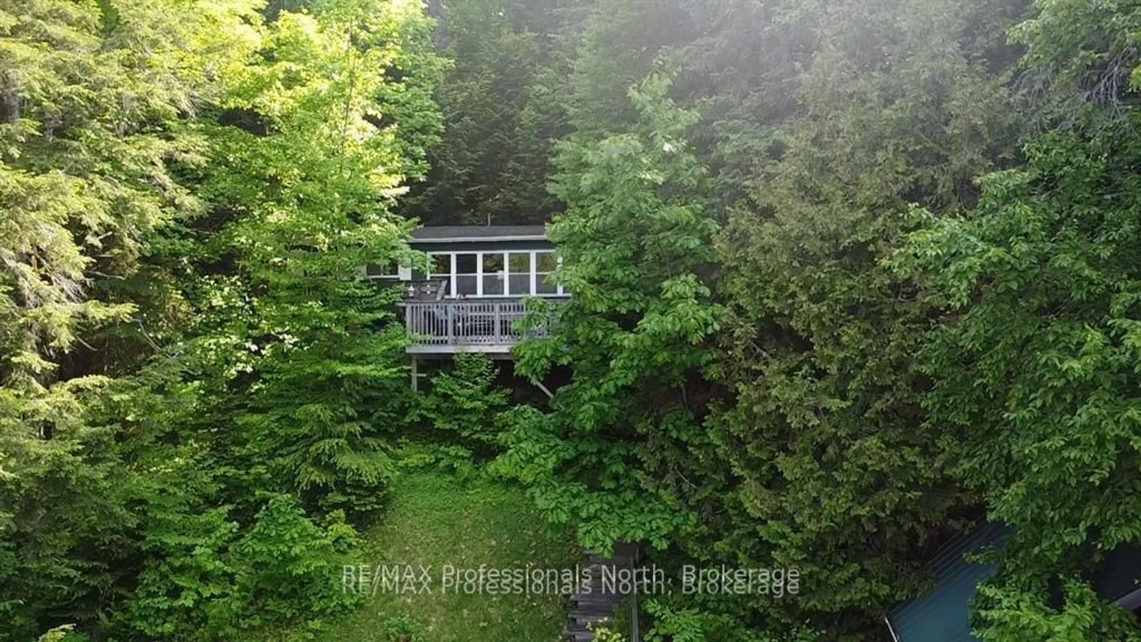 A pic from outside/outdoor area/front of a property/back of a property/a pic from drone, forest/trees view for 69 Maple Dr, Perry Ontario P0A 1J0