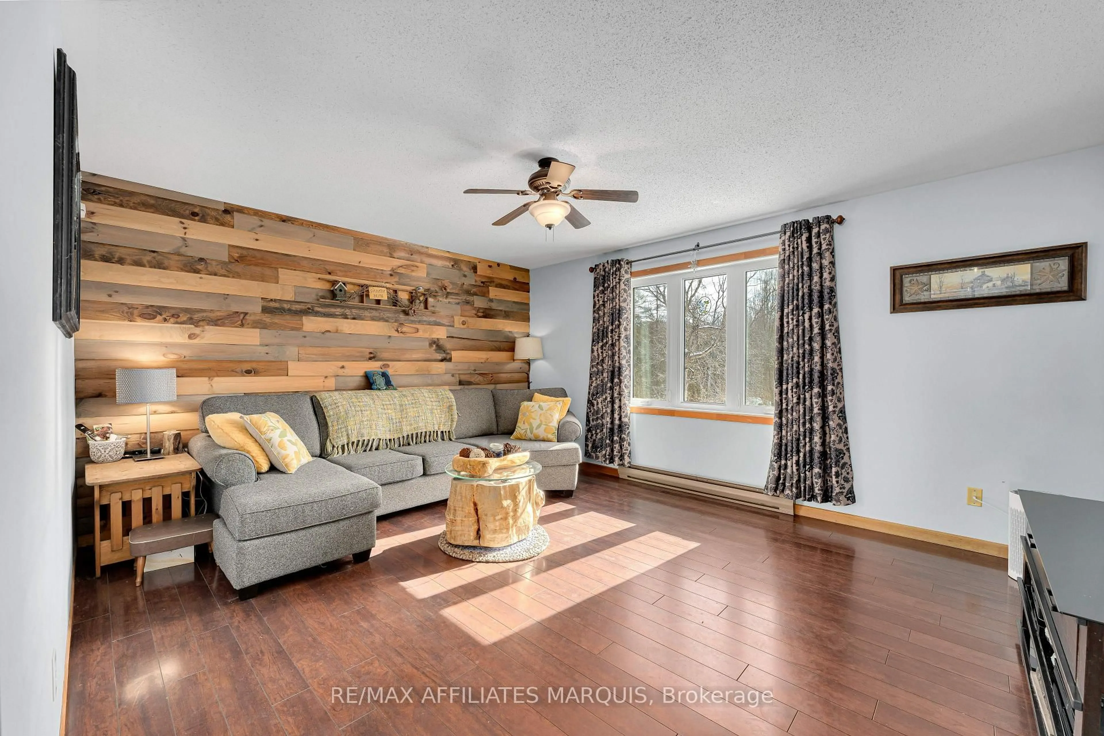 Living room with furniture, wood/laminate floor for 15913 509 Rd, Clarendon Station Ontario K0H 1J0