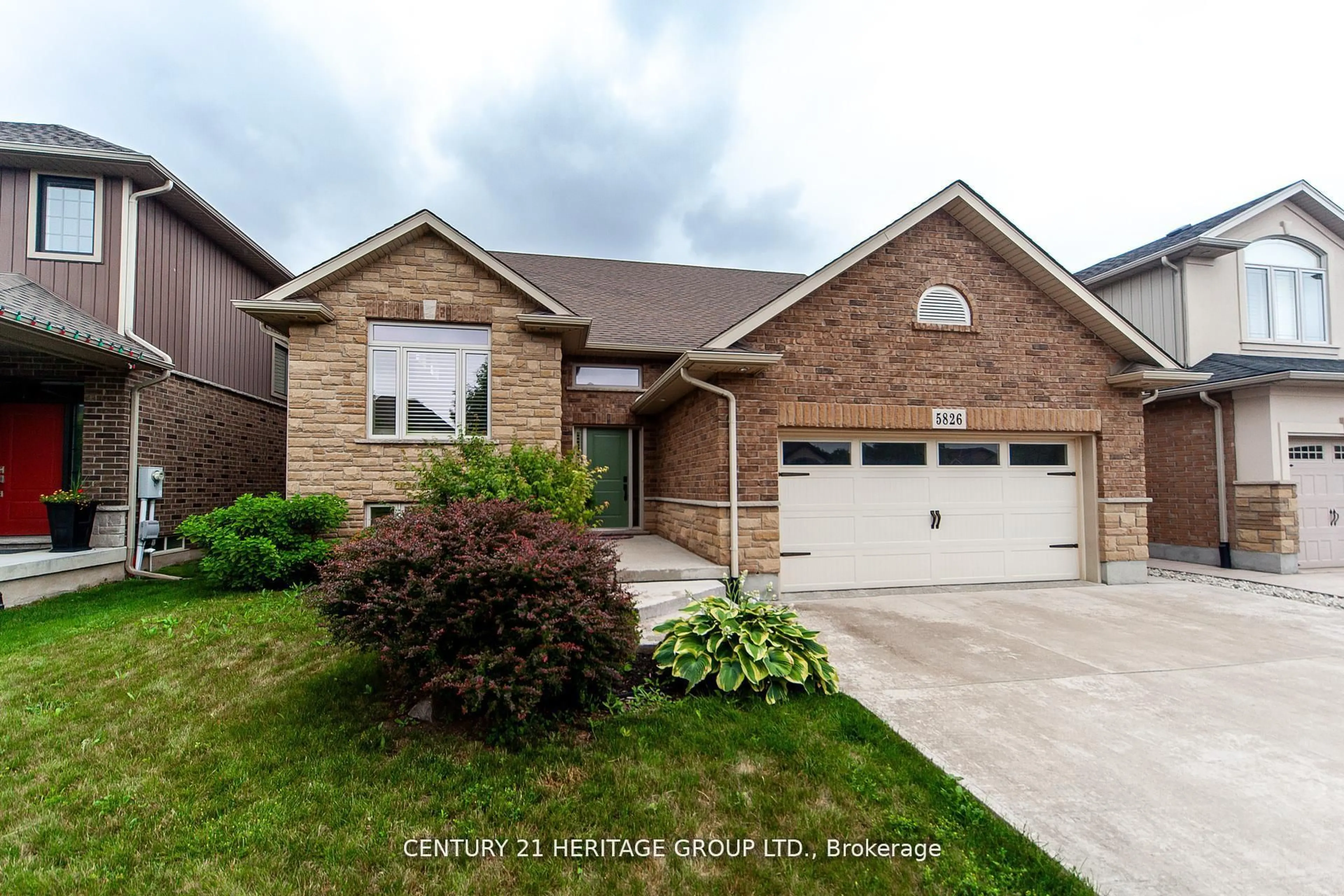 Home with brick exterior material, street for 5826 Fiddlehead Lane, Niagara Falls Ontario L2H 0E9