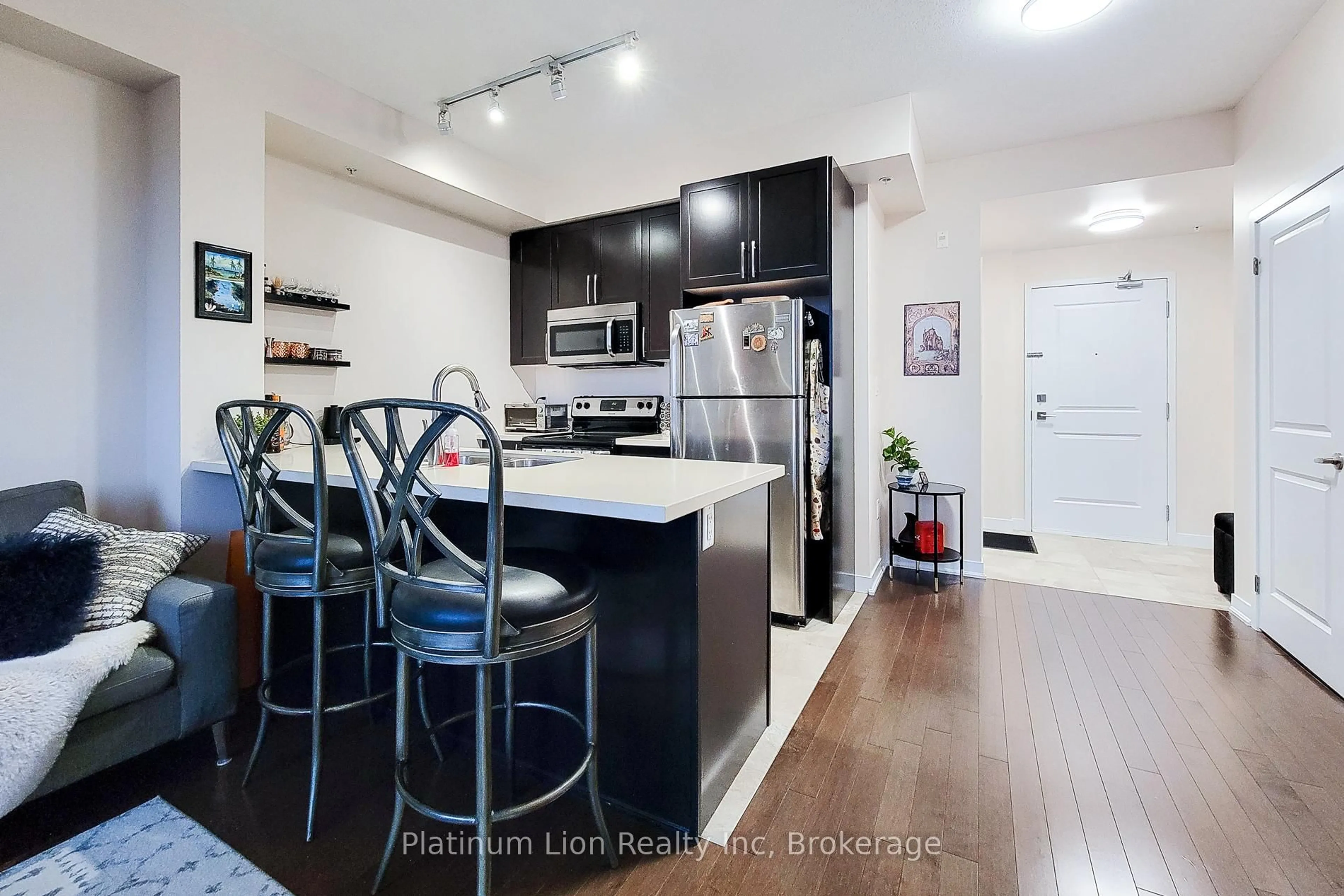 Open concept kitchen, wood/laminate floor for 85 Robinson St #703, Hamilton Ontario L8P 0B9