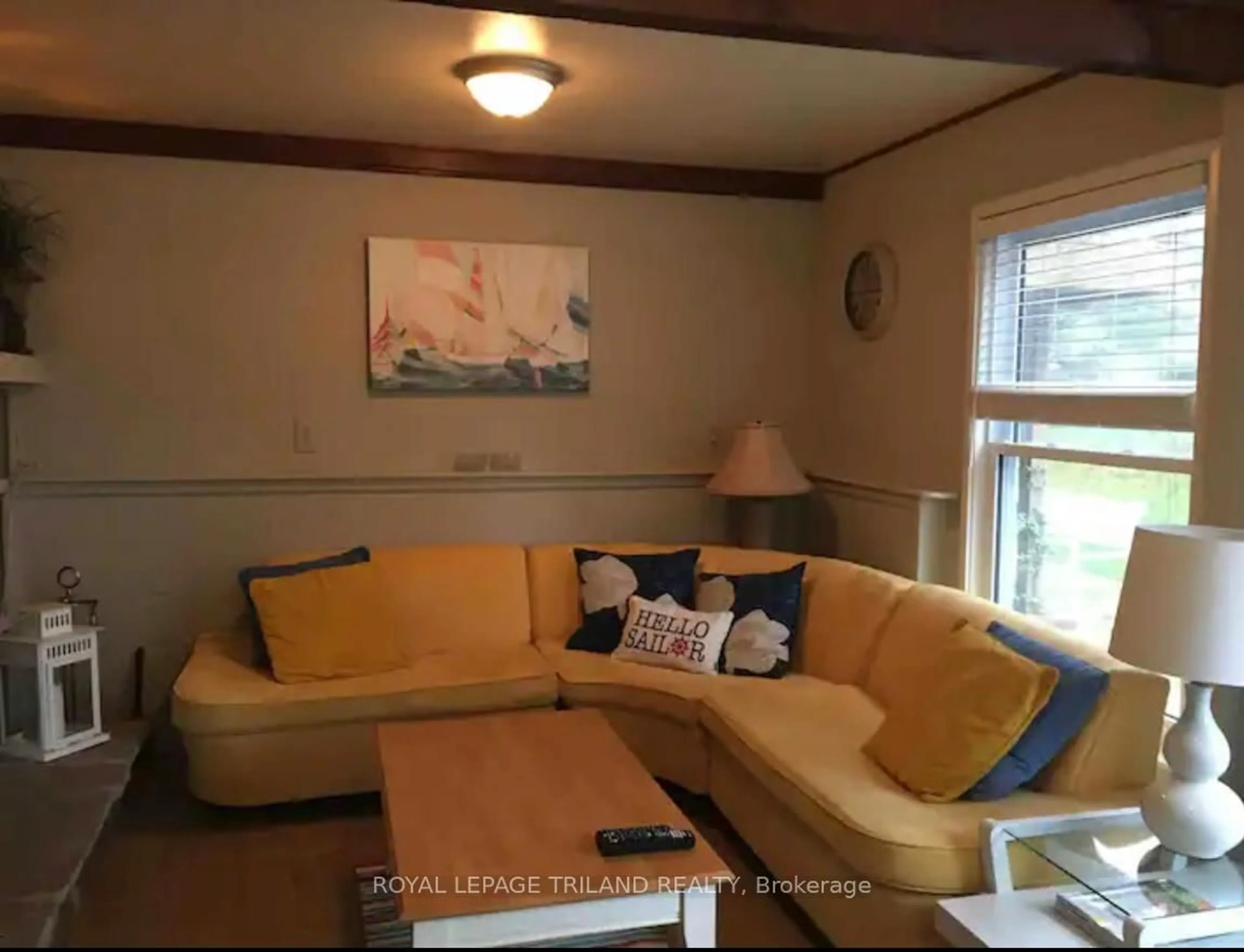 Living room with furniture, wood/laminate floor for 6329 William St, Lambton Shores Ontario N0N 1J2