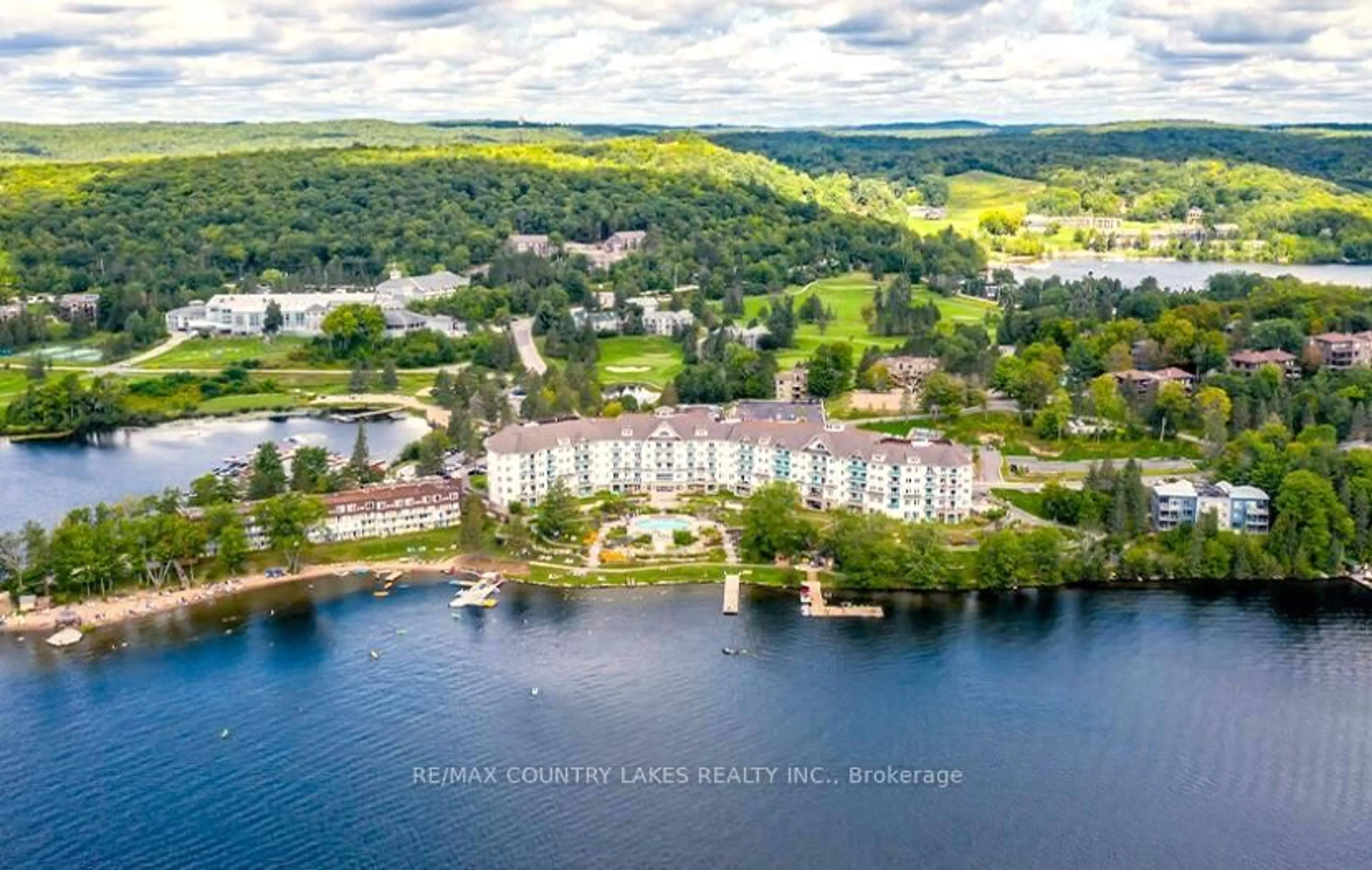 A pic from outside/outdoor area/front of a property/back of a property/a pic from drone, water/lake/river/ocean view for 1235 Deerhurst Dr #55-308, Huntsville Ontario P1H 2E8