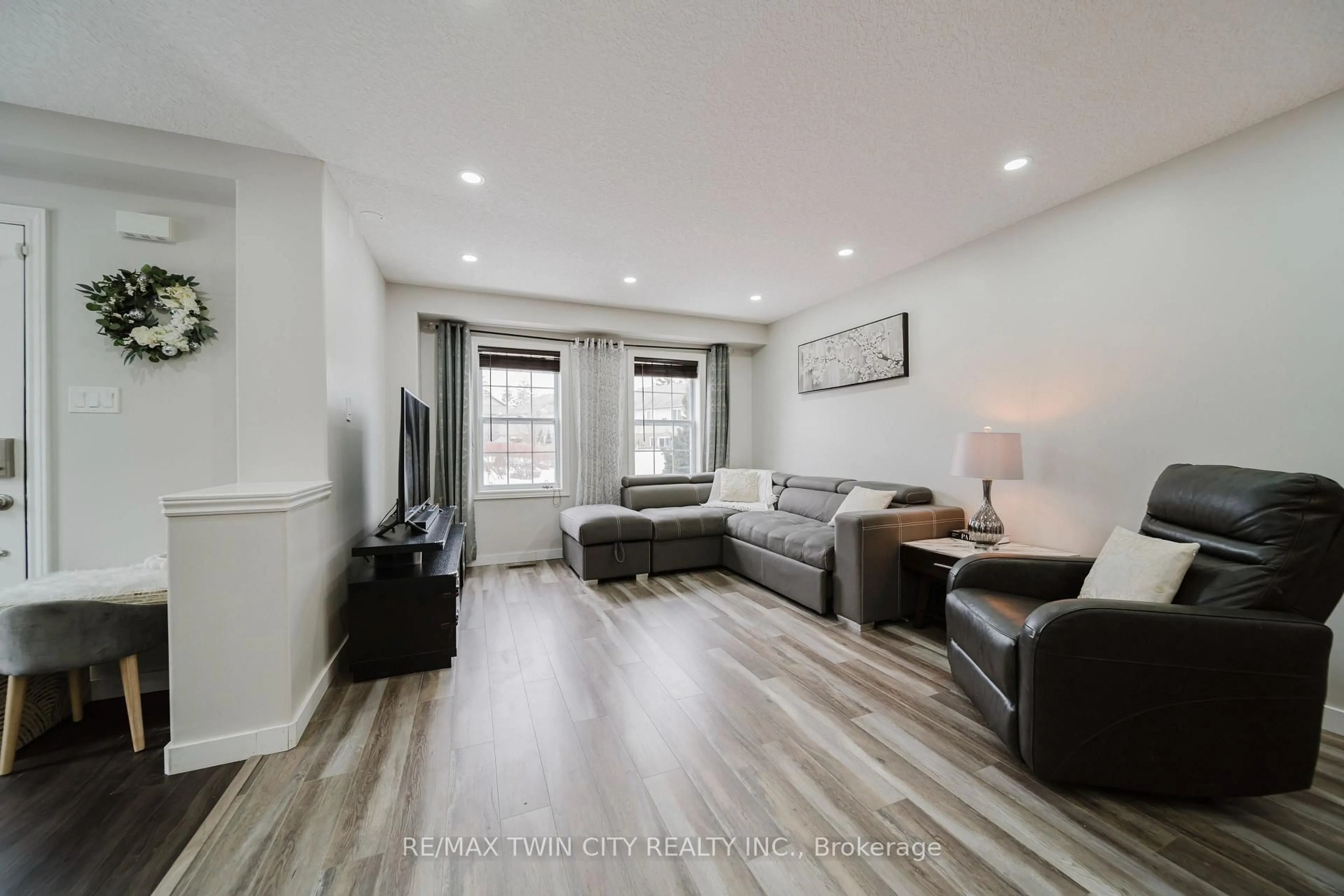 Living room with furniture, wood/laminate floor for 214 Snyder's Rd #2, Wilmot Ontario N3A 0A6