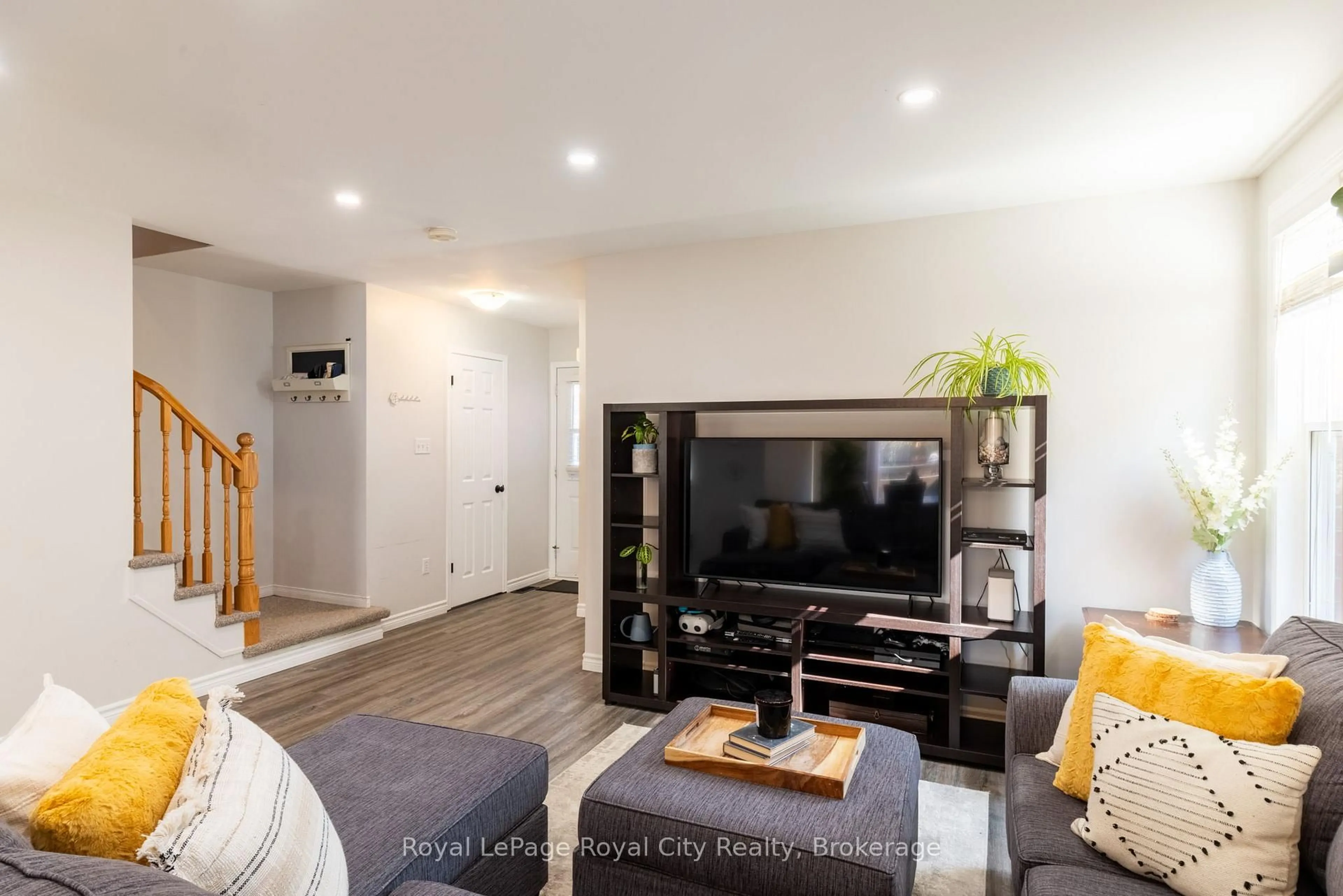 Living room with furniture, wood/laminate floor for 22 Law Dr, Guelph Ontario N1E 7G5