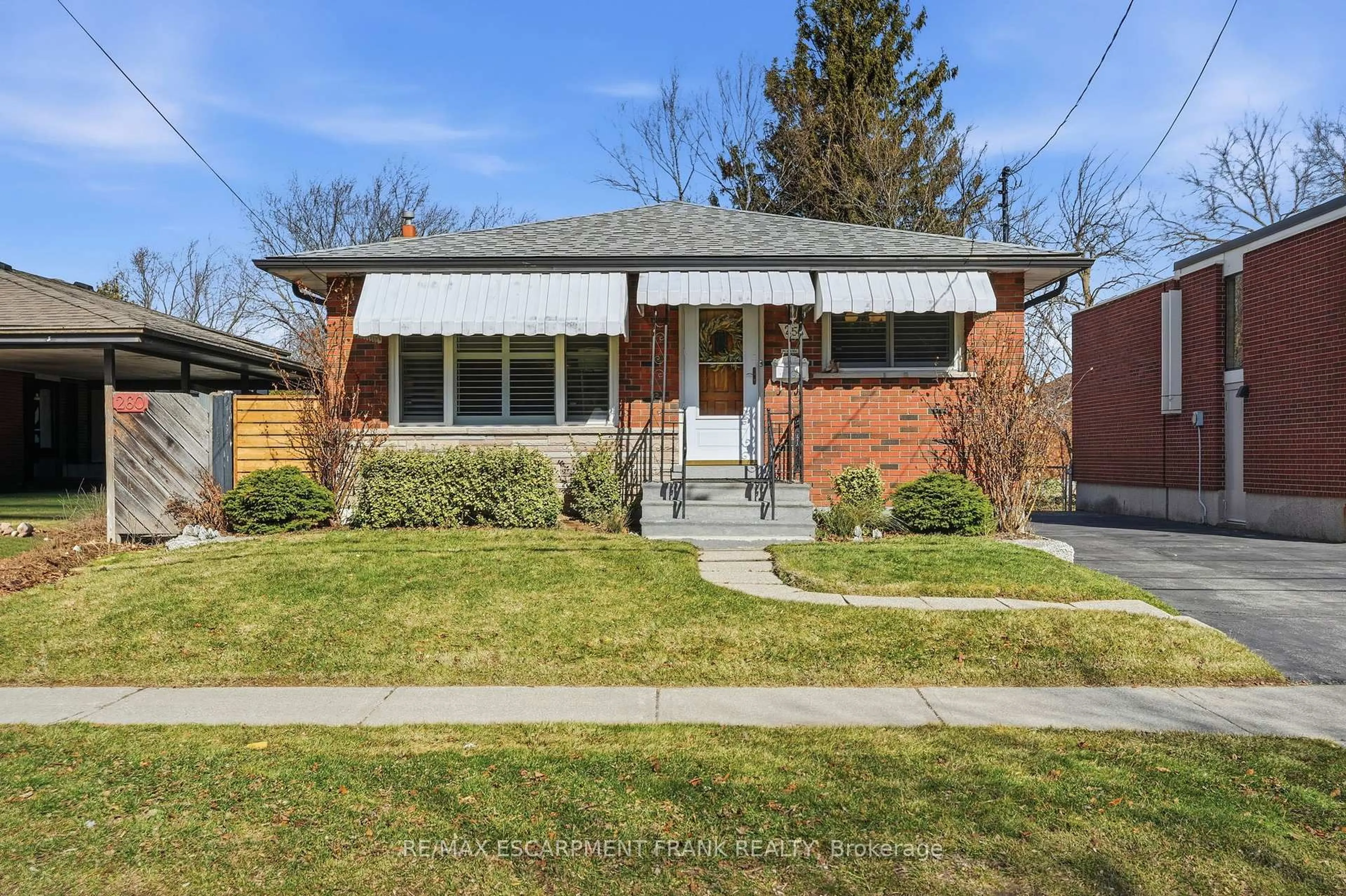 Home with brick exterior material, street for 256 Whitney Ave, Hamilton Ontario L8S 2G8
