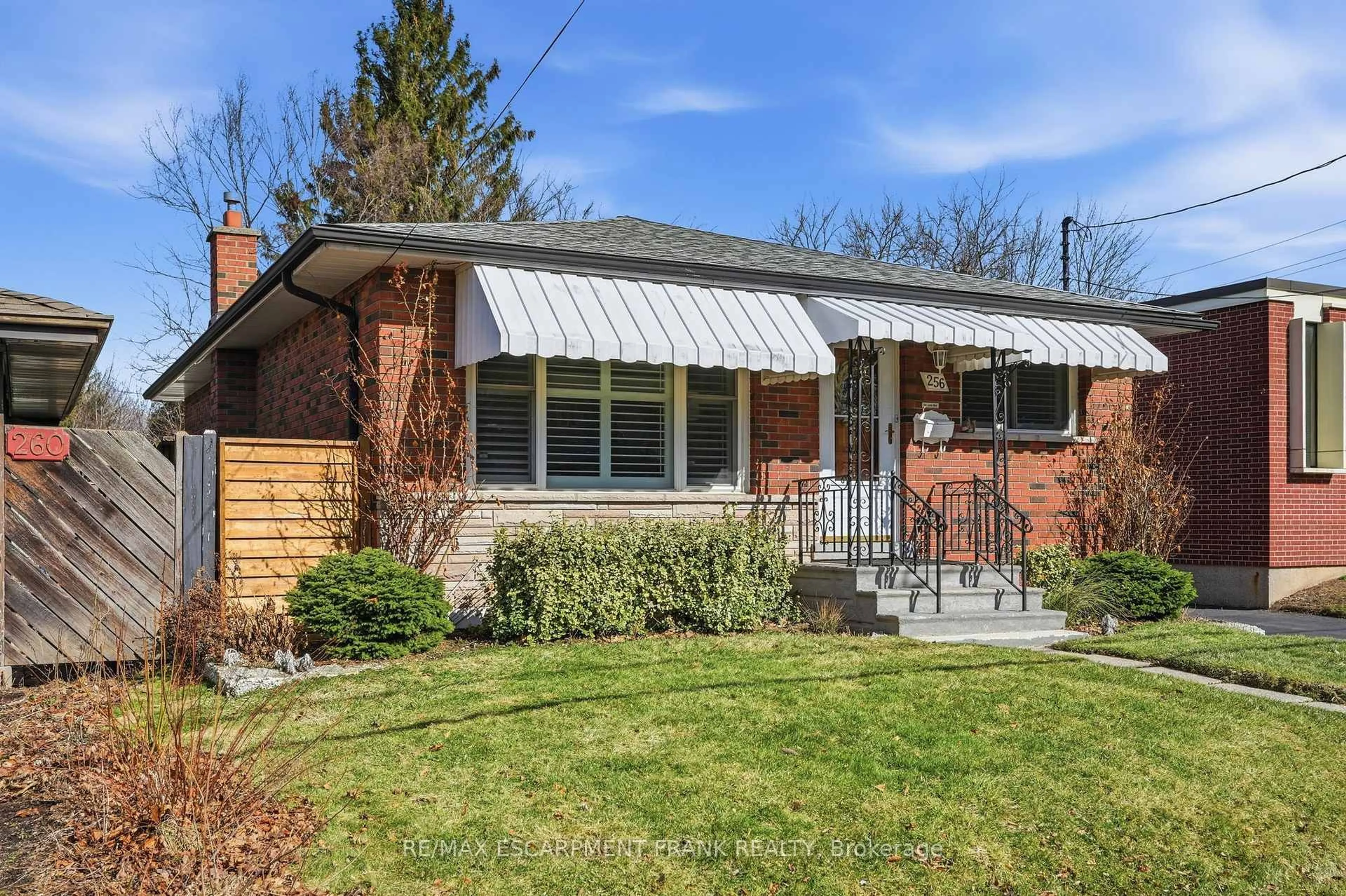 Home with brick exterior material, street for 256 Whitney Ave, Hamilton Ontario L8S 2G8