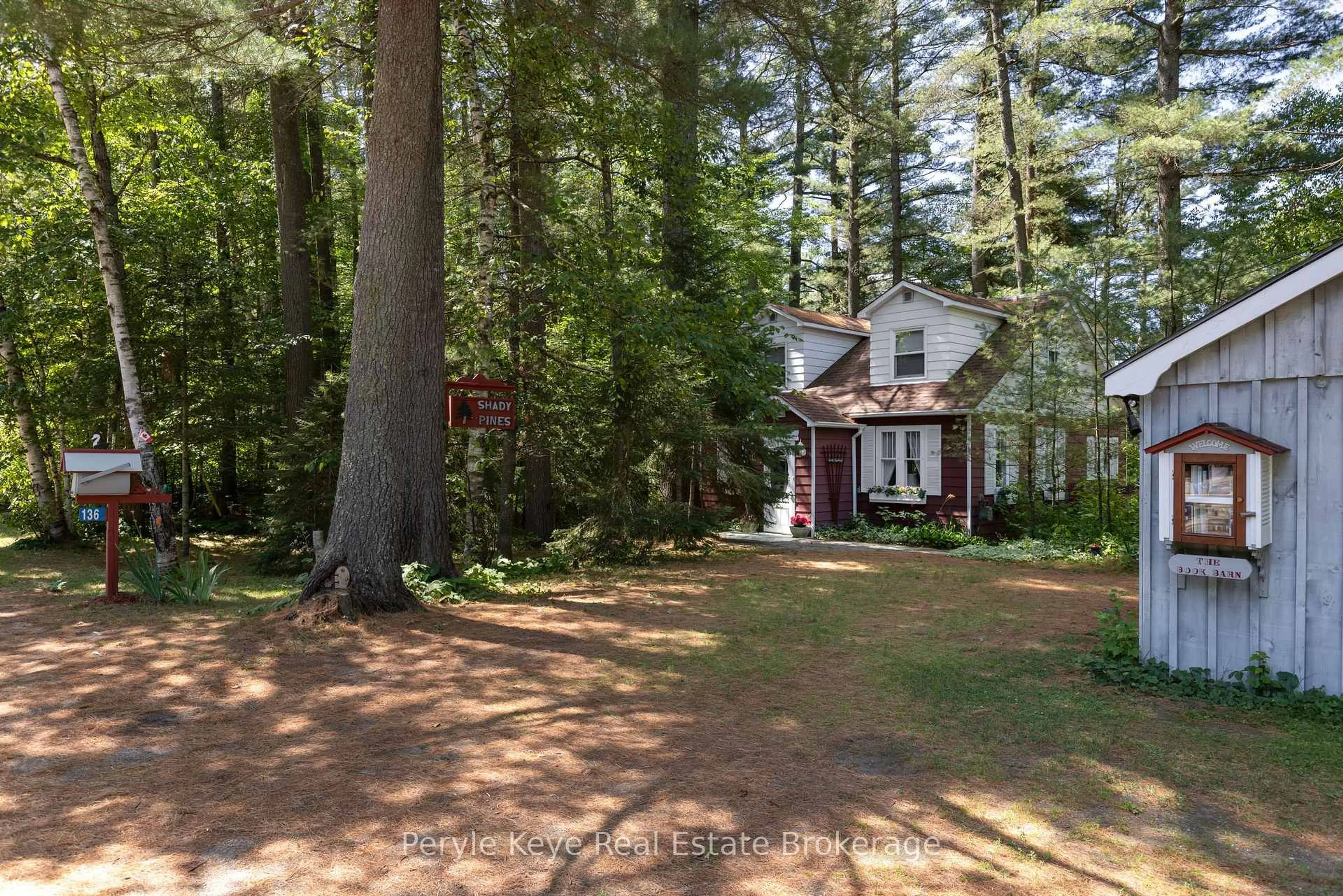 A pic from outside/outdoor area/front of a property/back of a property/a pic from drone, forest/trees view for 136 Deer Lake Rd, Huntsville Ontario P0B 1L0