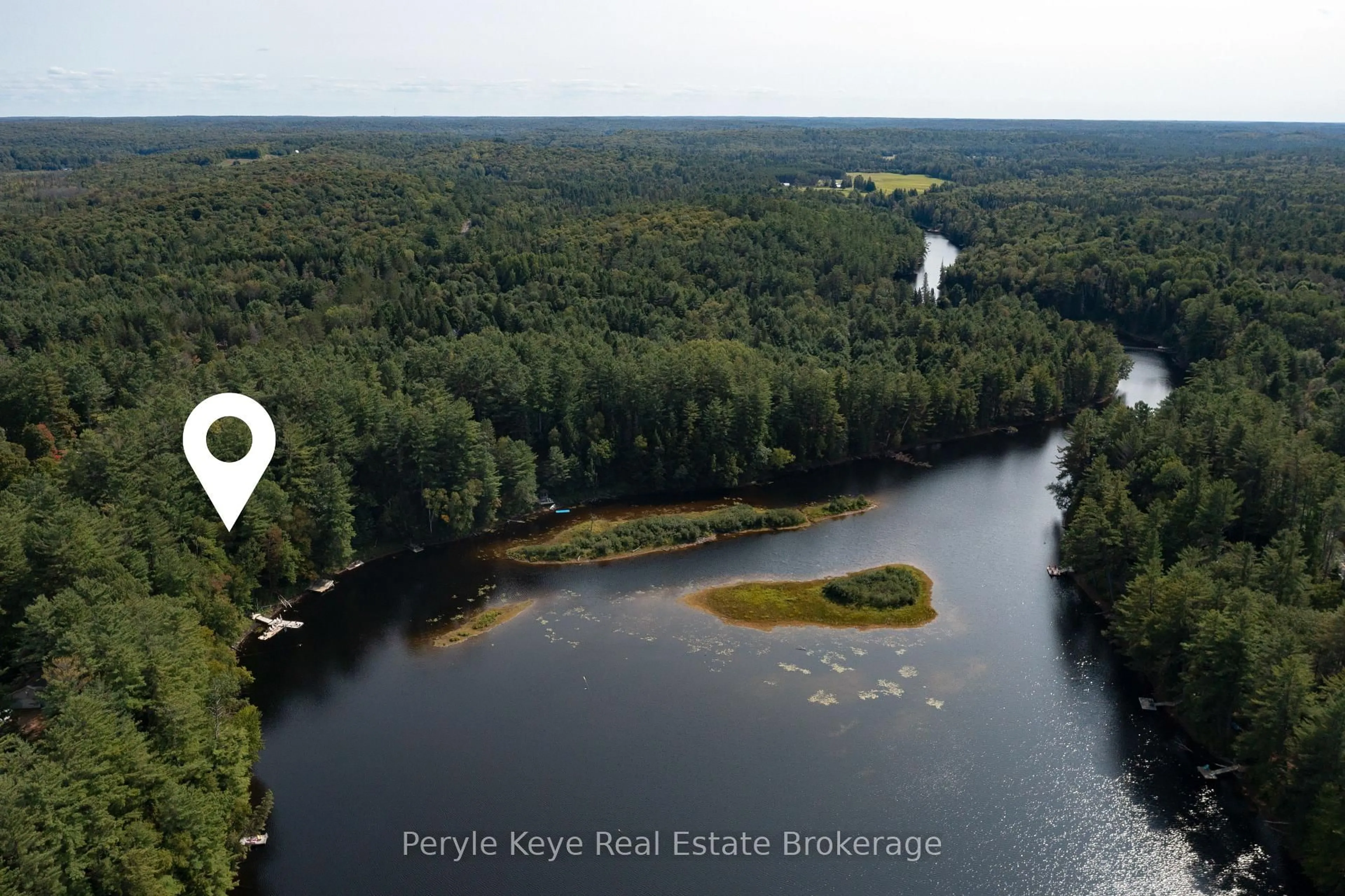 A pic from outside/outdoor area/front of a property/back of a property/a pic from drone, water/lake/river/ocean view for 136 Deer Lake Rd, Huntsville Ontario P0B 1L0