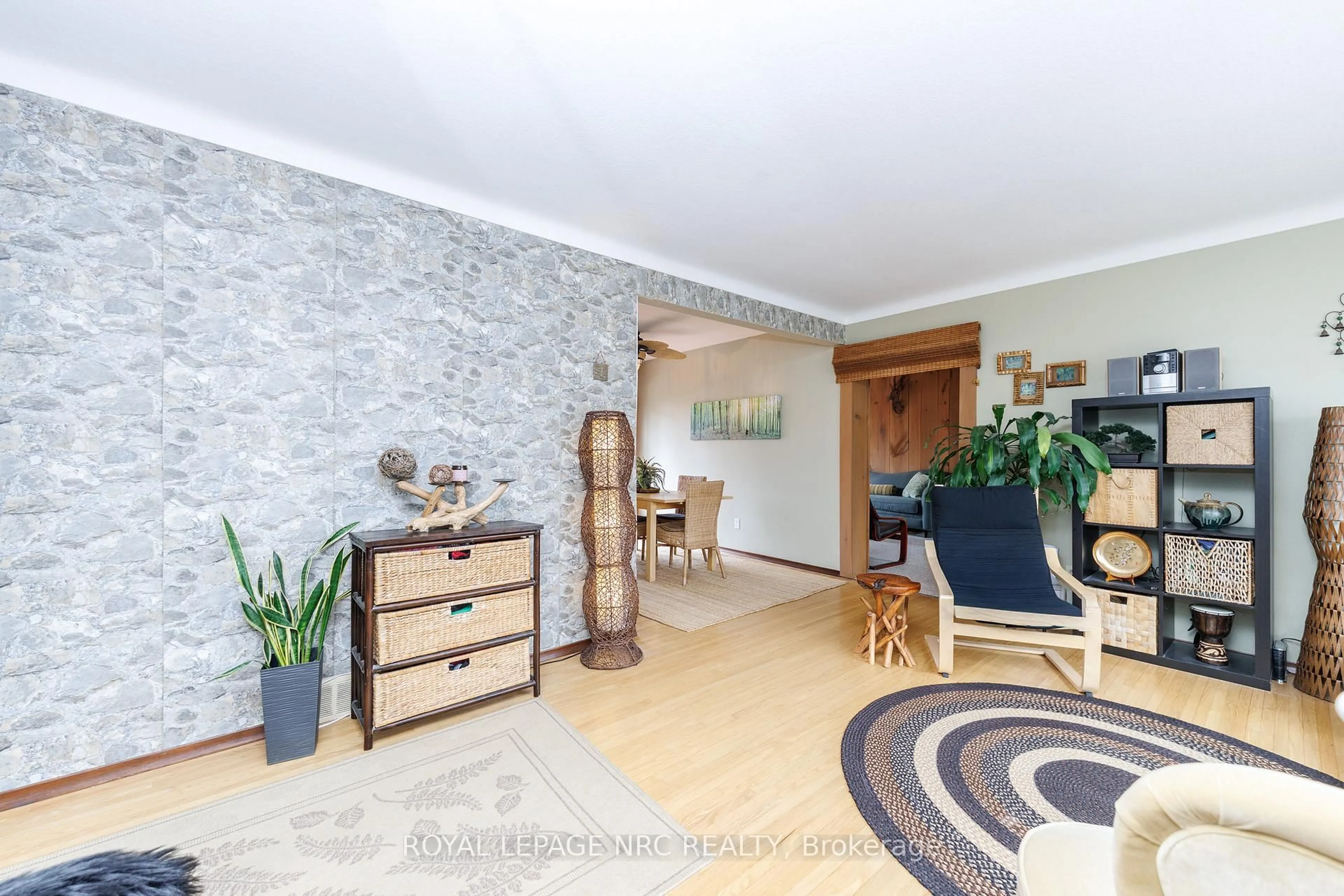 Living room with furniture, wood/laminate floor for 16 Rosemore Rd, St. Catharines Ontario L2S 1A8