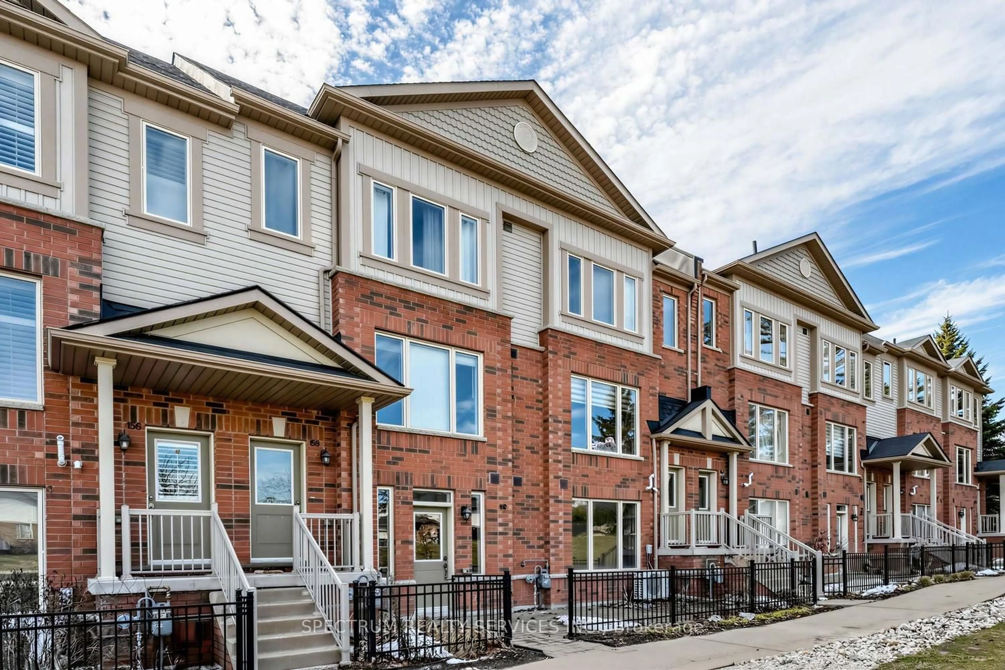 Home with brick exterior material, street for 160 Watson Rd #105, Guelph Ontario N1E 0P6