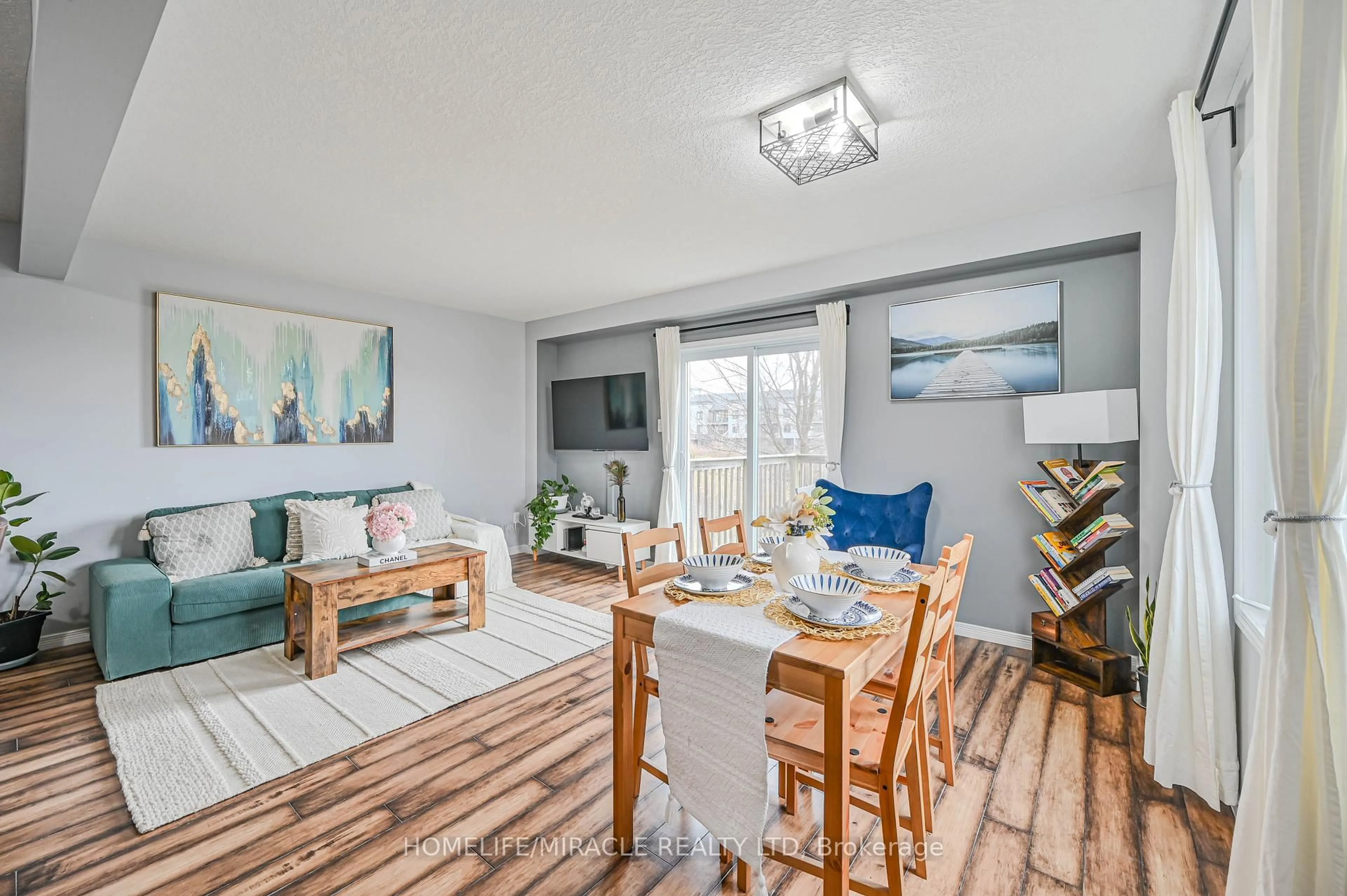 Living room with furniture, wood/laminate floor for 355 Fisher Mills Rd #70, Cambridge Ontario N3C 4N5