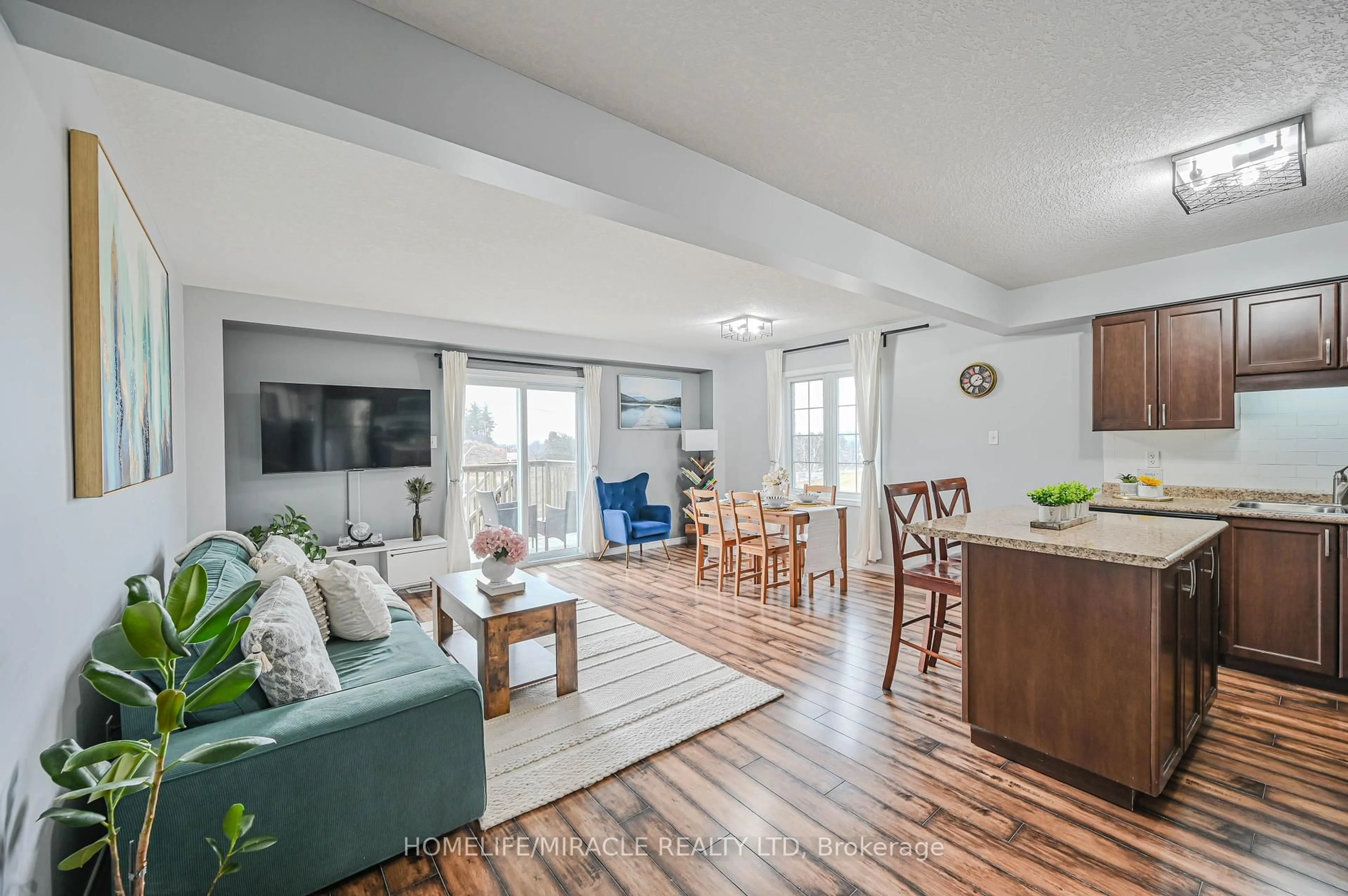 Living room with furniture, wood/laminate floor for 355 Fisher Mills Rd #70, Cambridge Ontario N3C 4N5