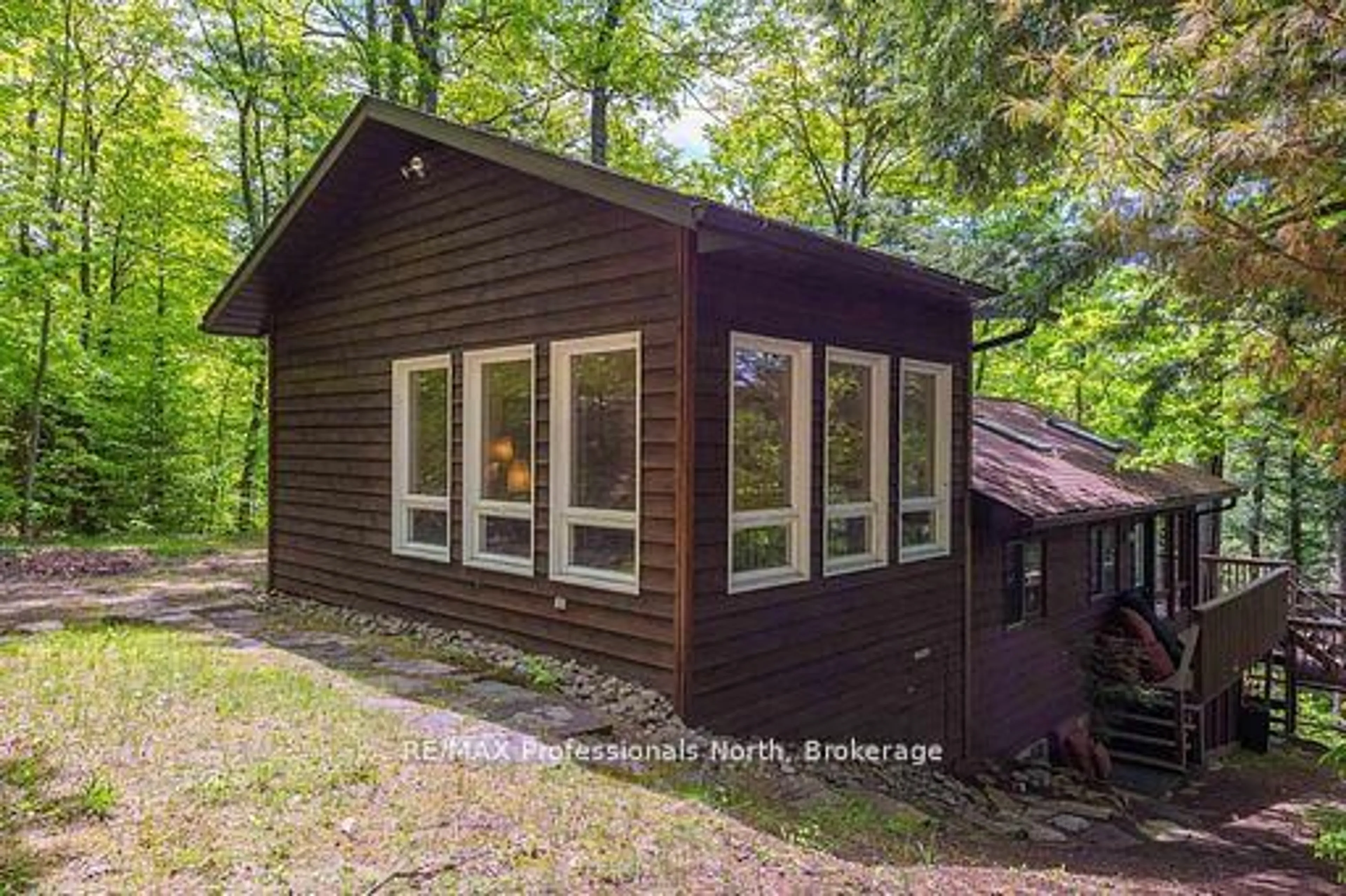 Home with vinyl exterior material, forest/trees view for 1023 Maiden Tr, Minden Hills Ontario K0M 2K0