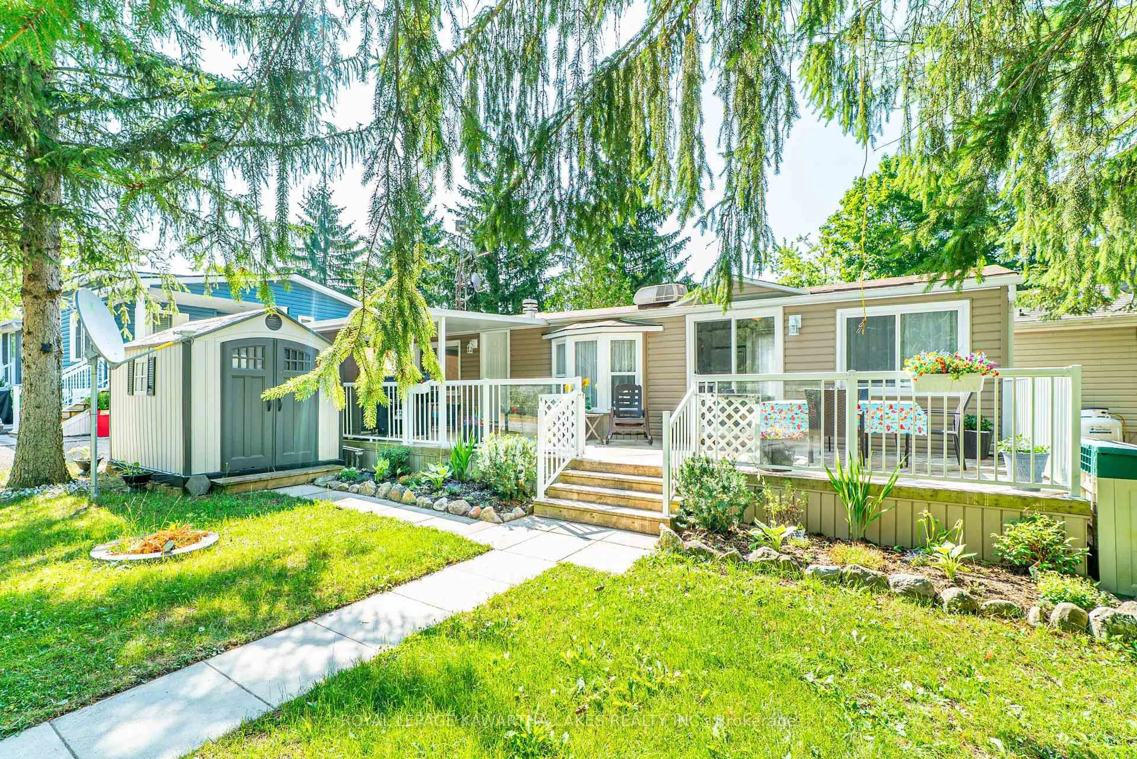 Home with vinyl exterior material, street for 2152 Hwy 36 #Lot 53, Kawartha Lakes Ontario K0M 1L0