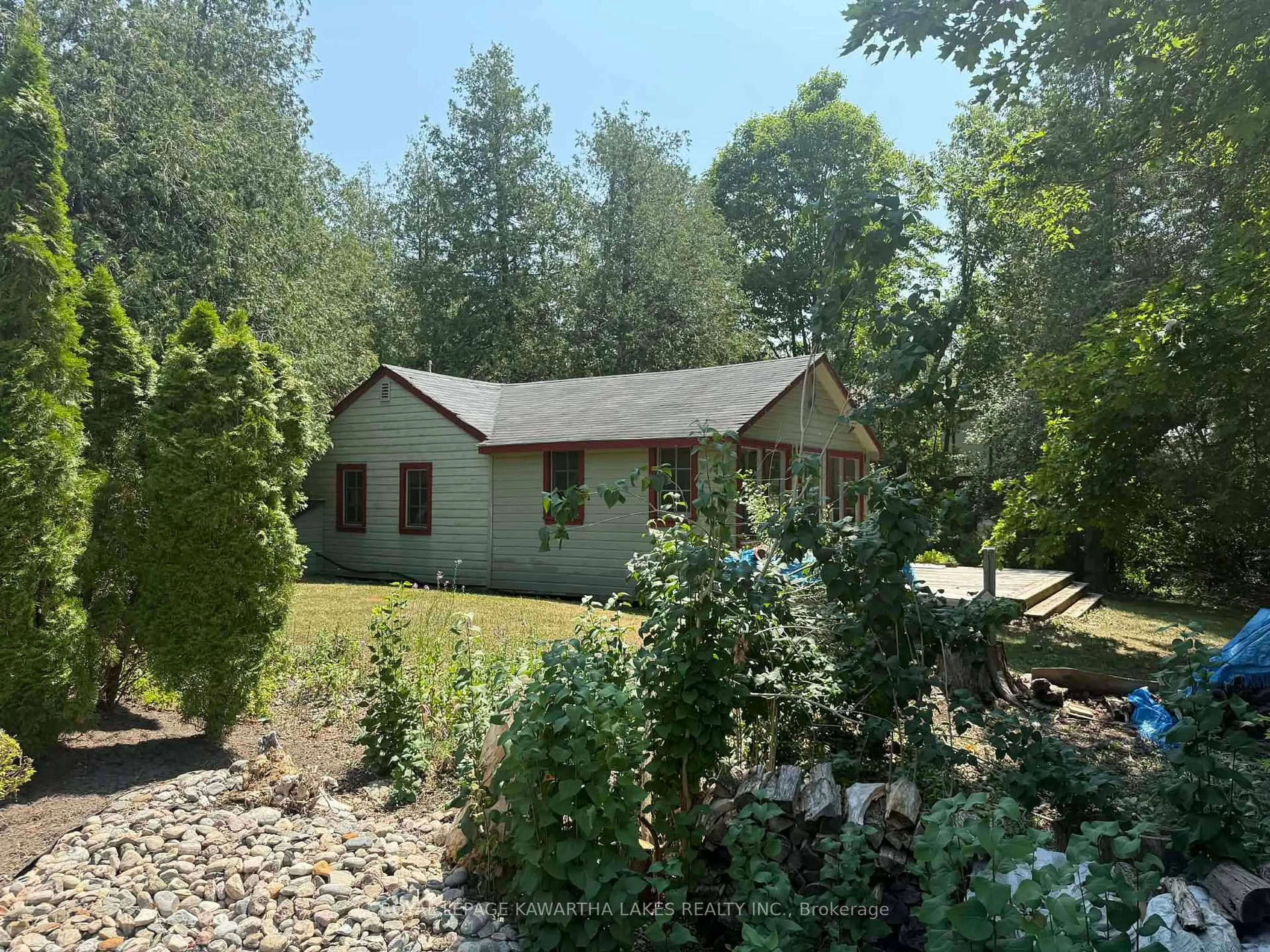 A pic from outside/outdoor area/front of a property/back of a property/a pic from drone, forest/trees view for 8 Sturgeon Glen Rd, Kawartha Lakes Ontario K0M 1N0