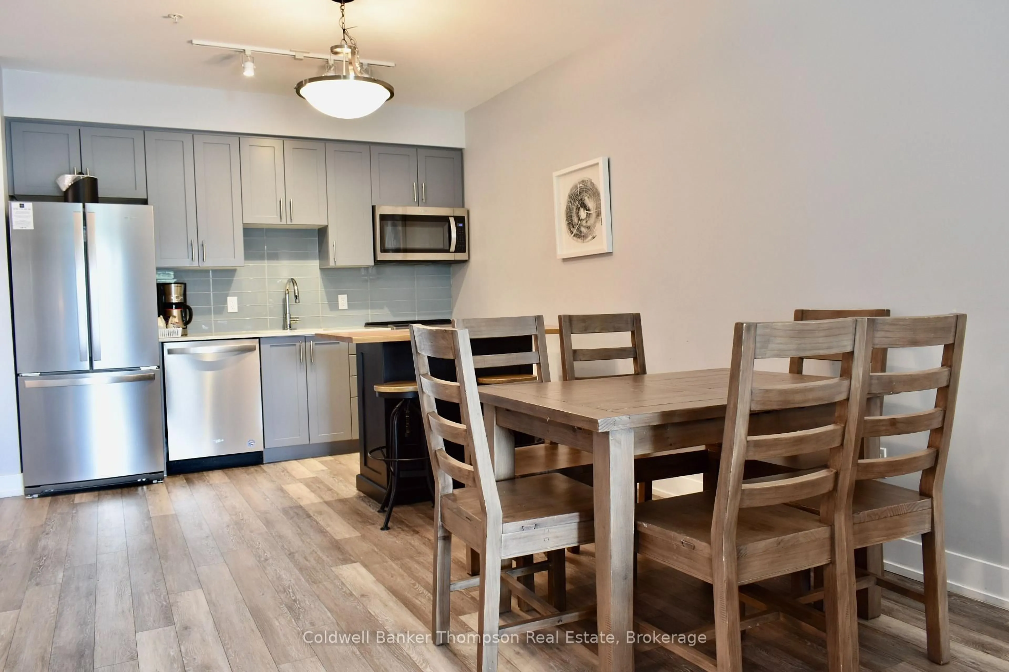 Open concept kitchen, wood/laminate floor for 25 Pen Lake Point Rd #021, Huntsville Ontario P1H 1A9