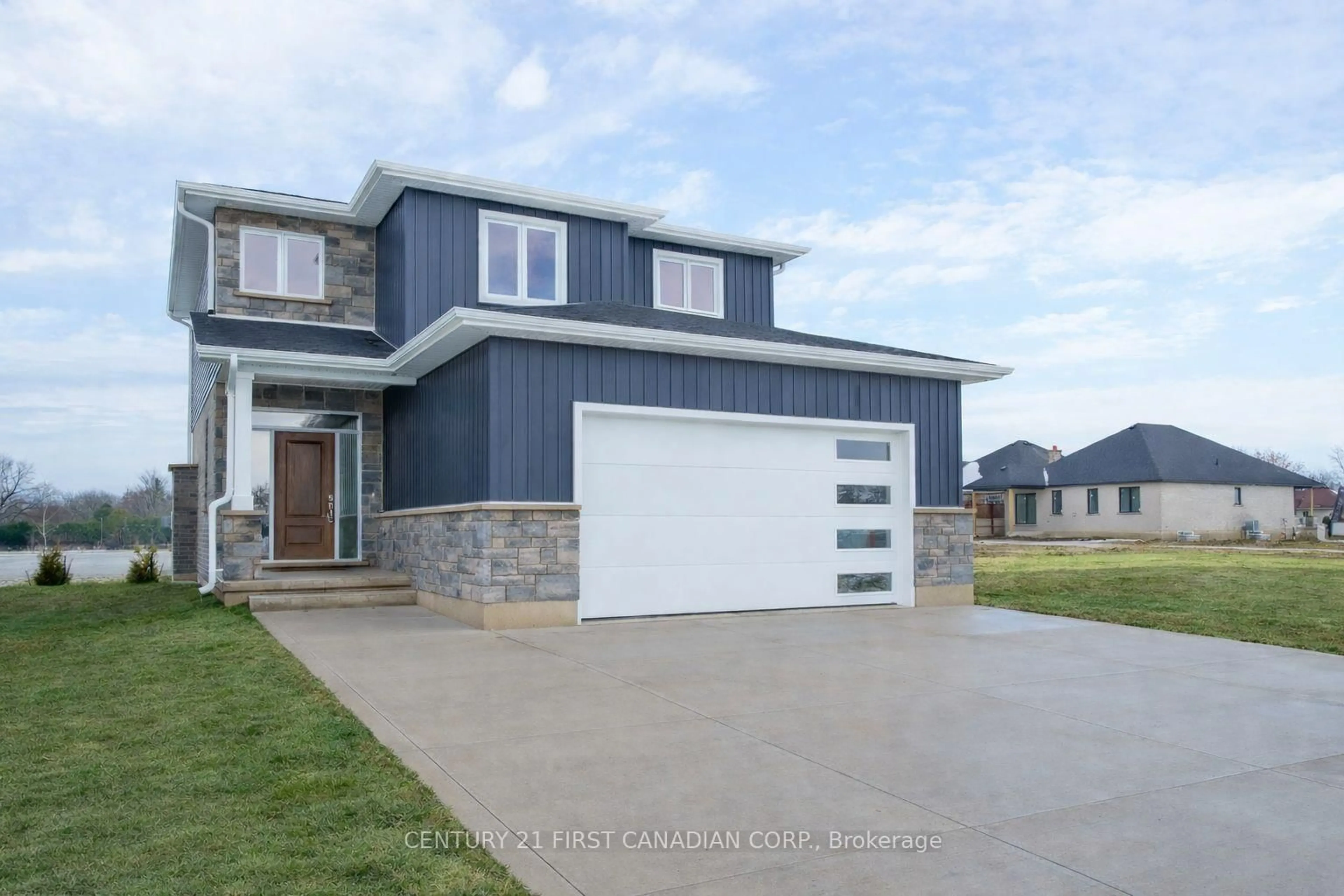 Home with vinyl exterior material, street for 115 Atkinson St, North Middlesex Ontario N0M 1A0