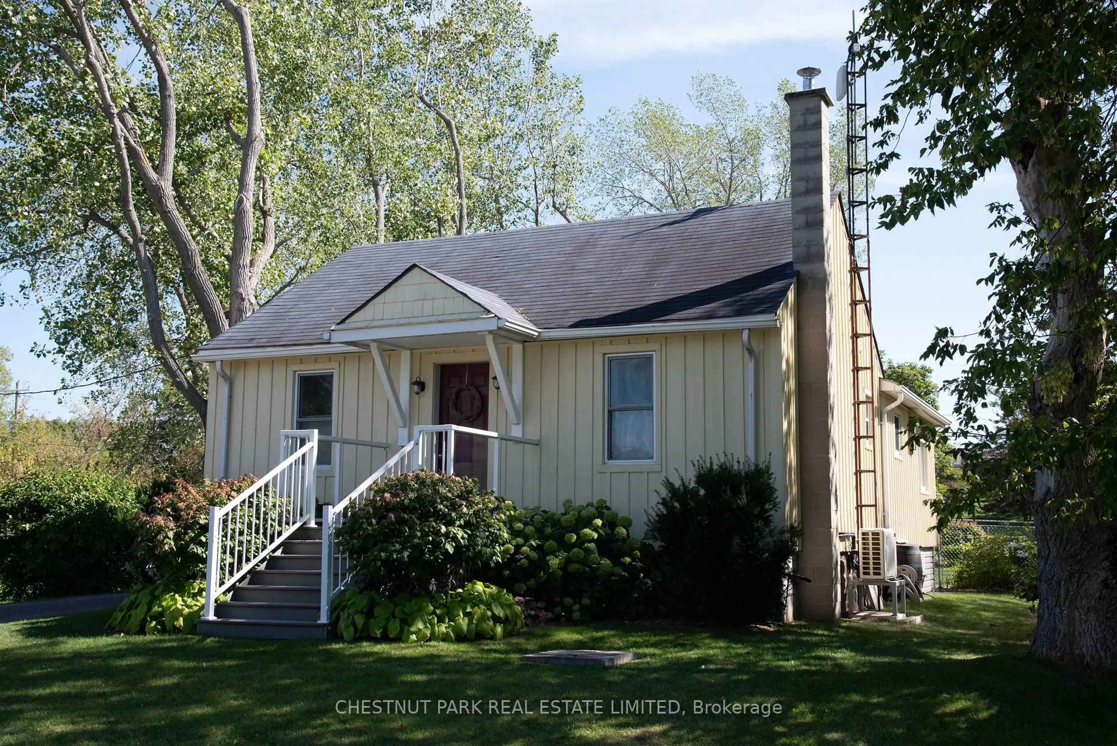 Home with vinyl exterior material, street for 2992 County Road 10, Prince Edward County Ontario K0K 2P0