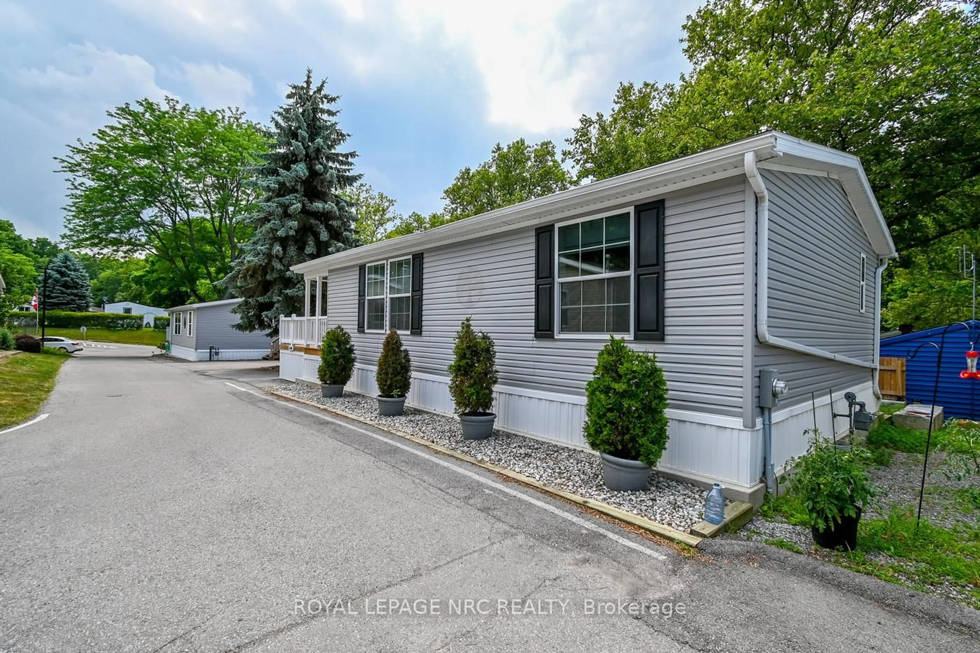 Home with vinyl exterior material, street for 23 Four Mile Creek Rd #440, Niagara-on-the-Lake Ontario L0S 1J1