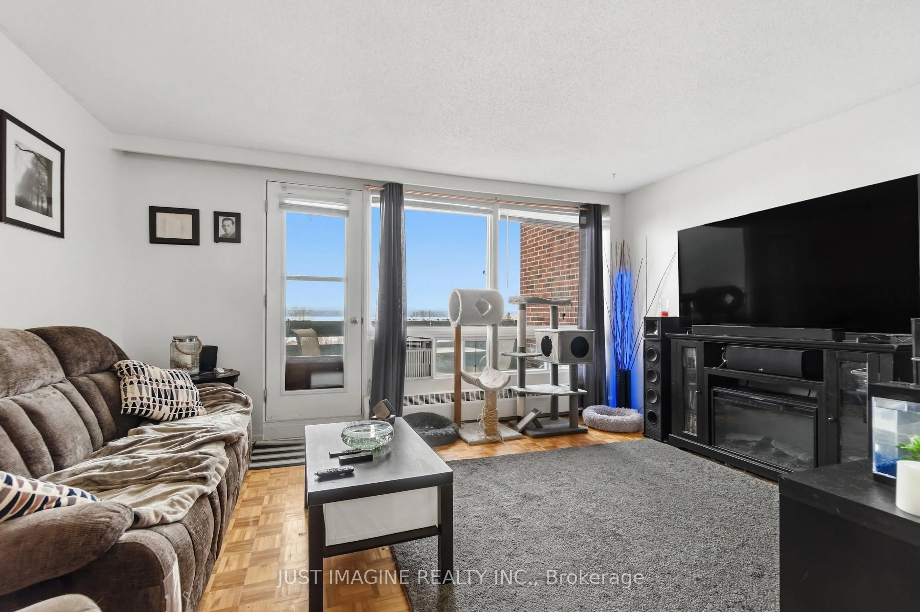 Living room with furniture, unknown for 3100 Carling Ave #721, Ottawa Ontario K2B 6J6