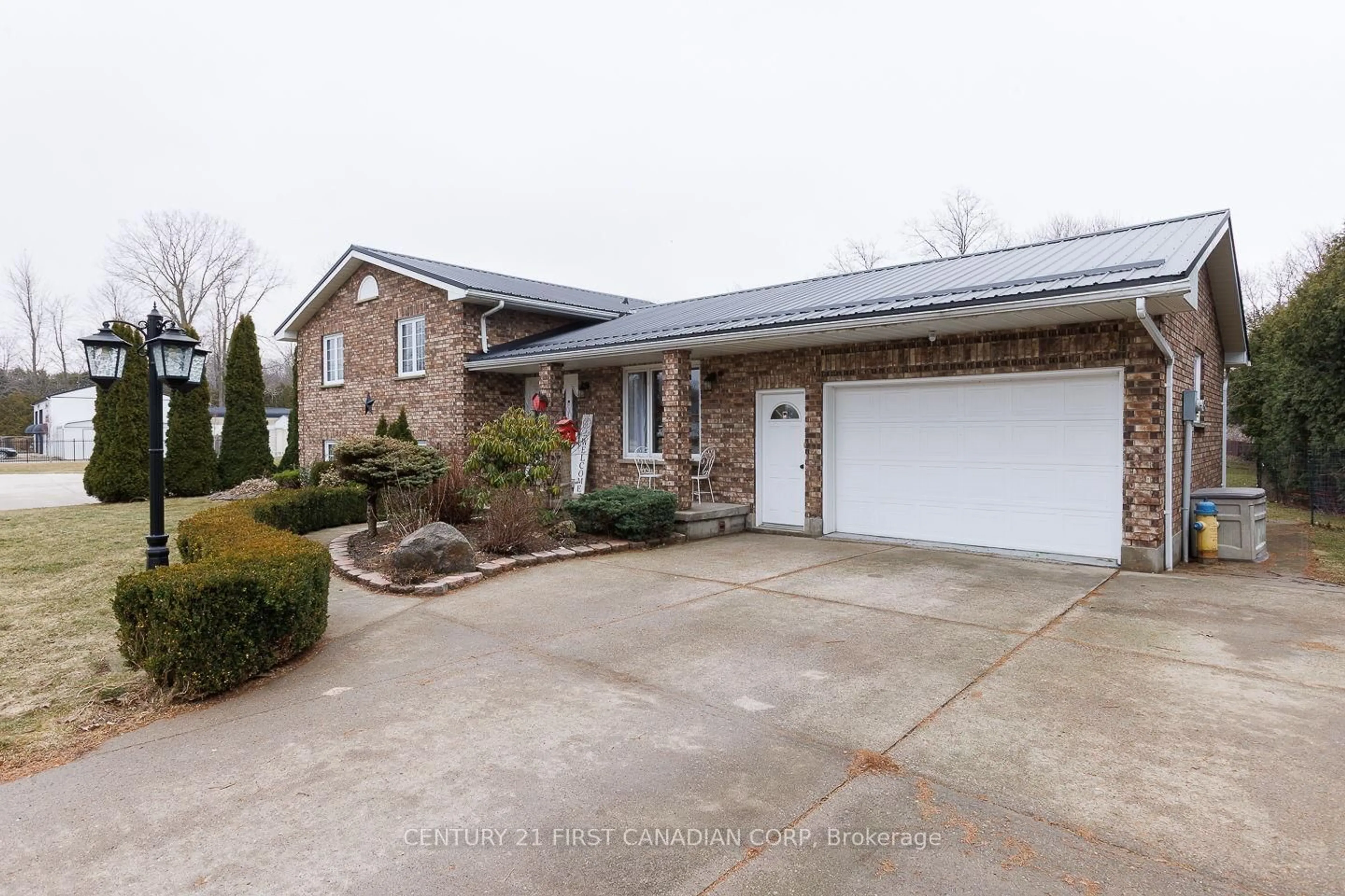 Home with brick exterior material, street for 24565 Pioneer Line, West Elgin Ontario N0L 2P0