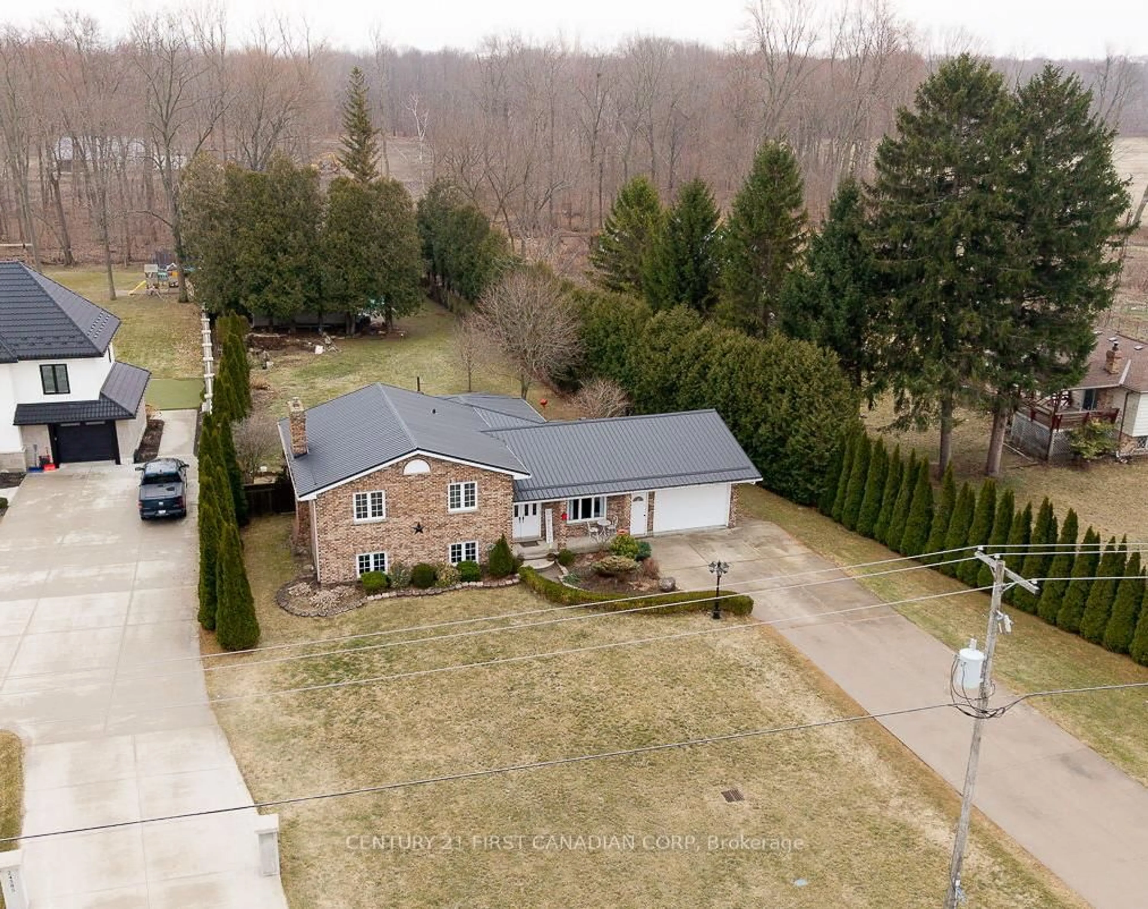 A pic from outside/outdoor area/front of a property/back of a property/a pic from drone, street for 24565 Pioneer Line, West Elgin Ontario N0L 2P0