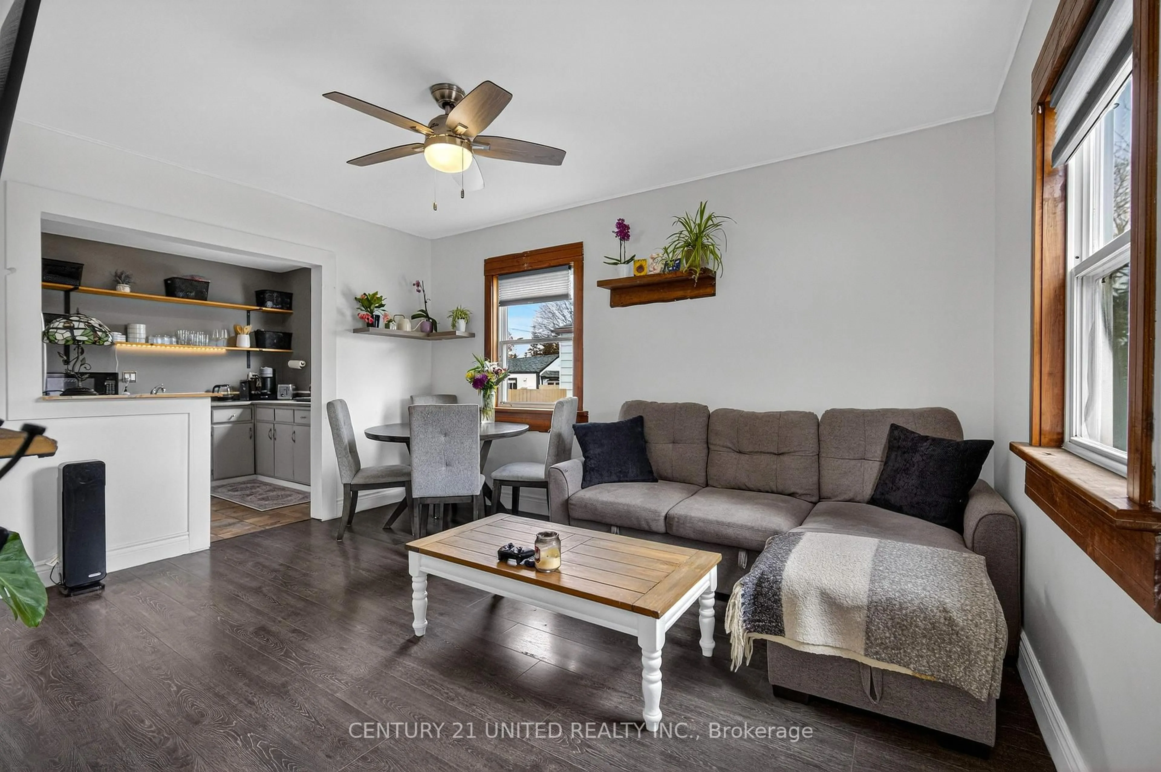 Living room with furniture, wood/laminate floor for 542 Mckellar St, Peterborough Ontario K9J 1R2