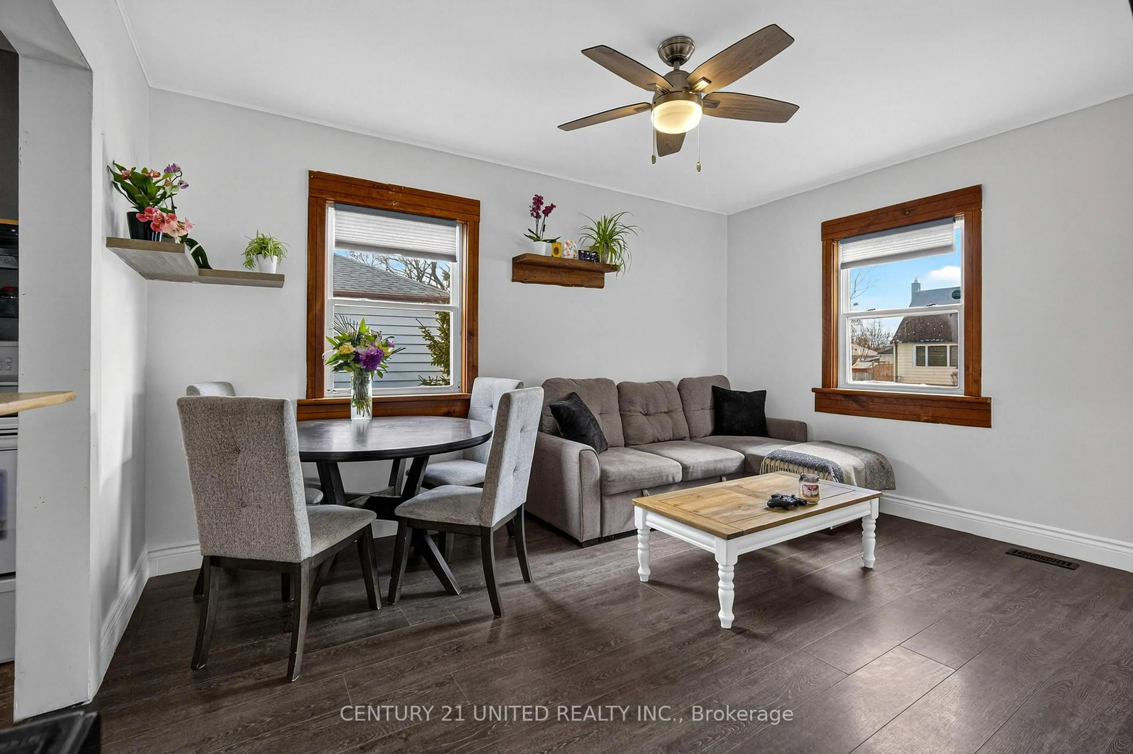 Living room with furniture, wood/laminate floor for 542 Mckellar St, Peterborough Ontario K9J 1R2