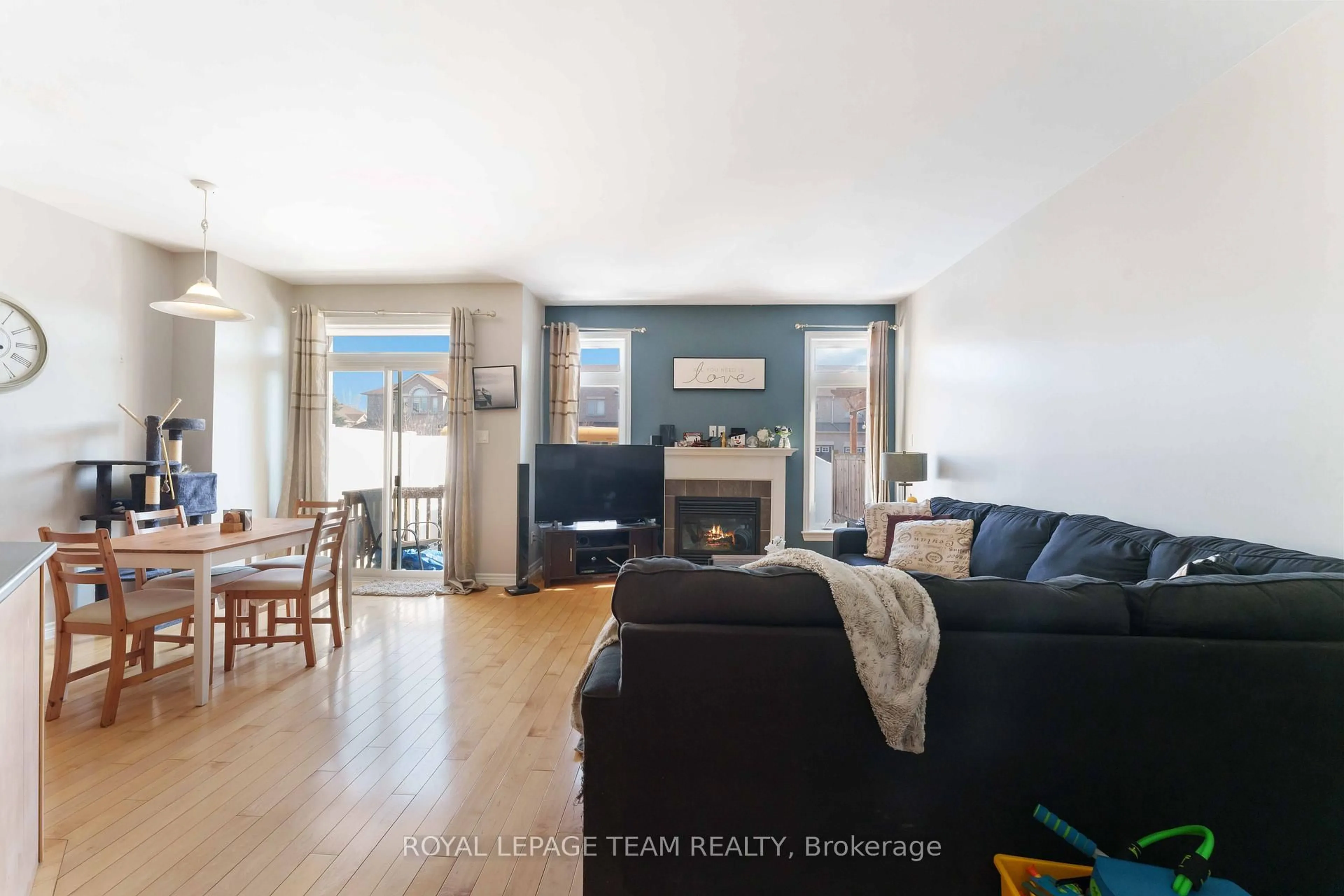 Living room with furniture, wood/laminate floor for 106 WHISPERING WINDS Way, Ottawa Ontario K1W 0B6