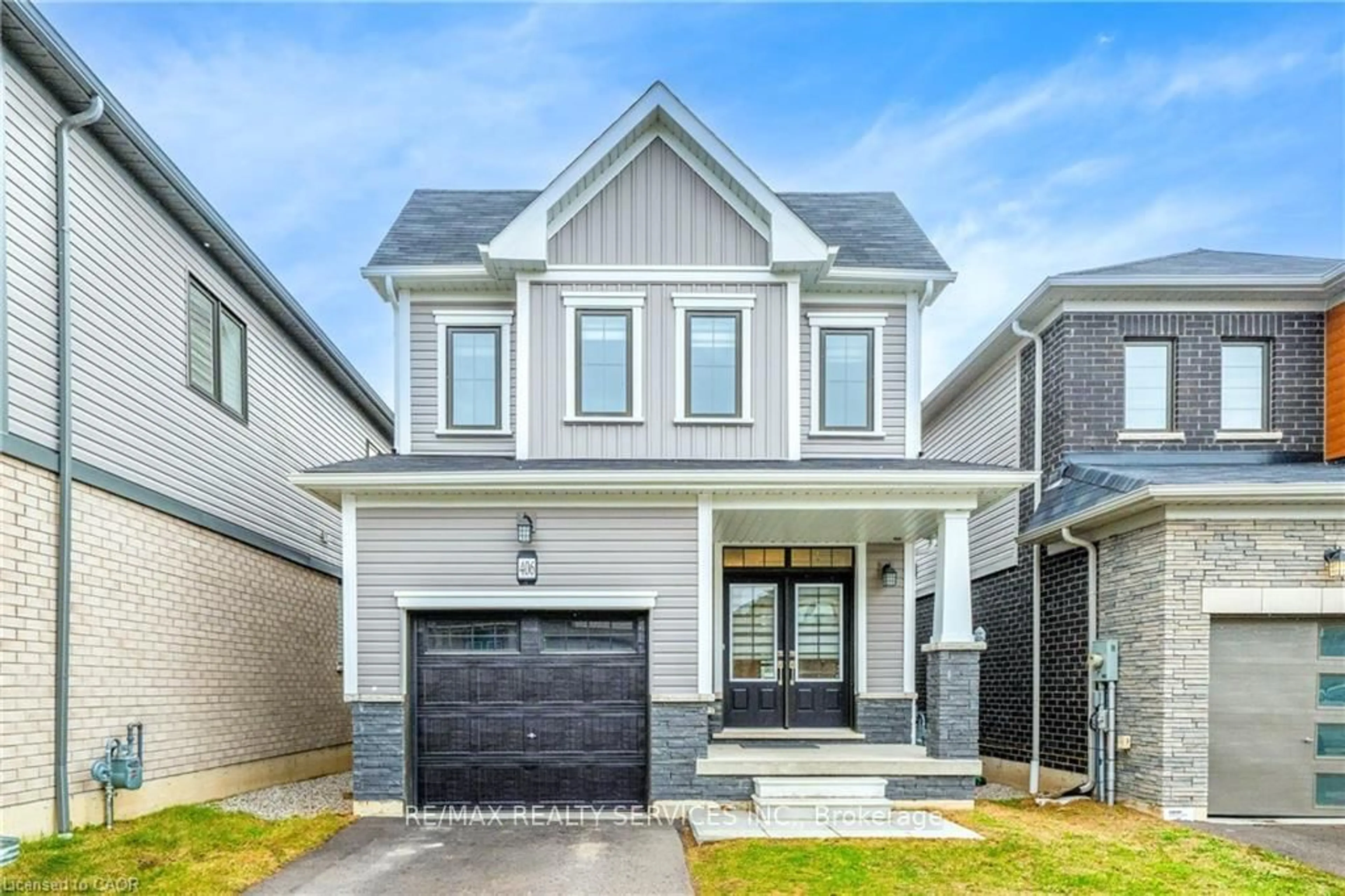 Home with brick exterior material, street for 406 Dolman St, Woolwich Ontario N0B 1M0