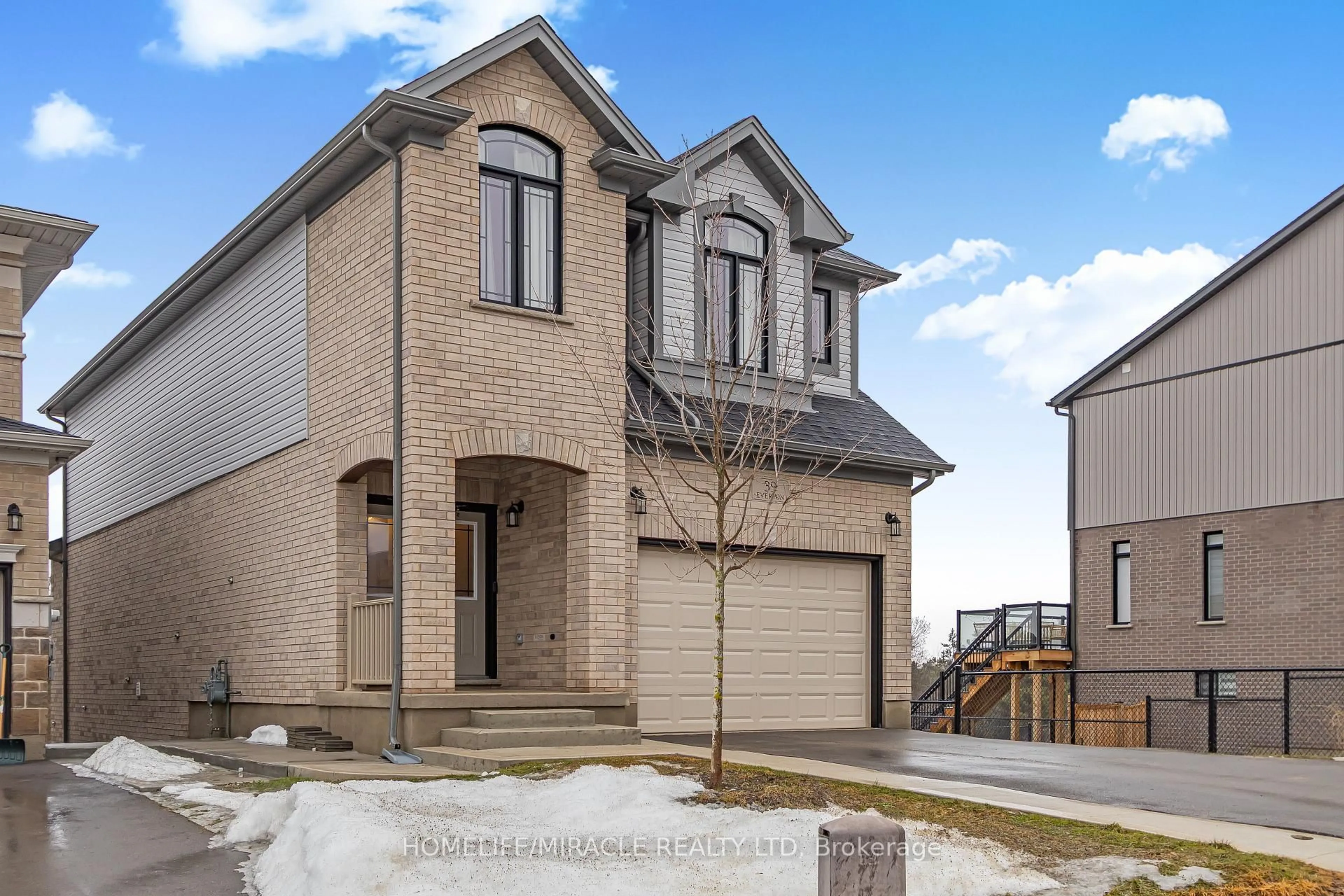 Home with brick exterior material, street for 39 Everton Dr, Guelph Ontario N1E 0R9