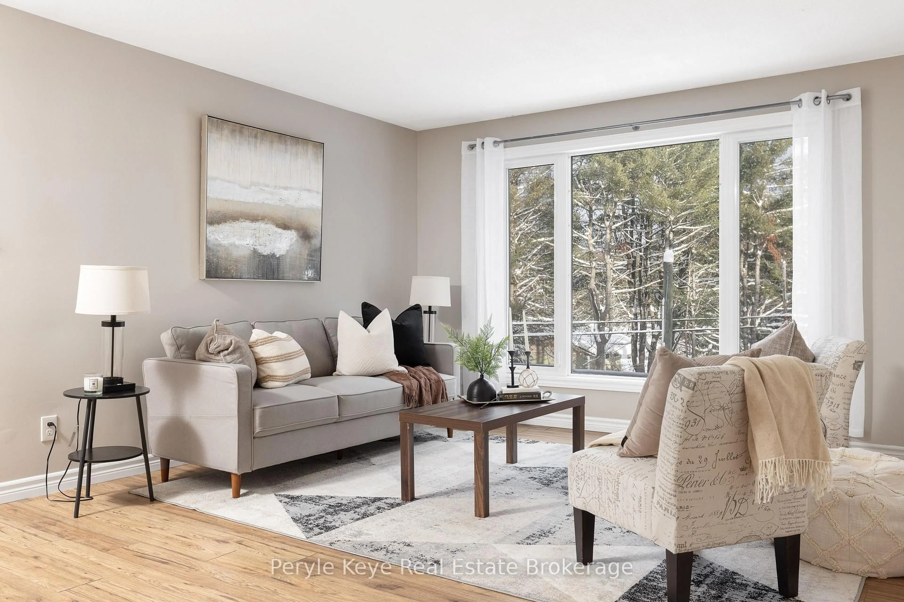 Living room with furniture, wood/laminate floor for 820 Manitoba St, Bracebridge Ontario P1L 1W9