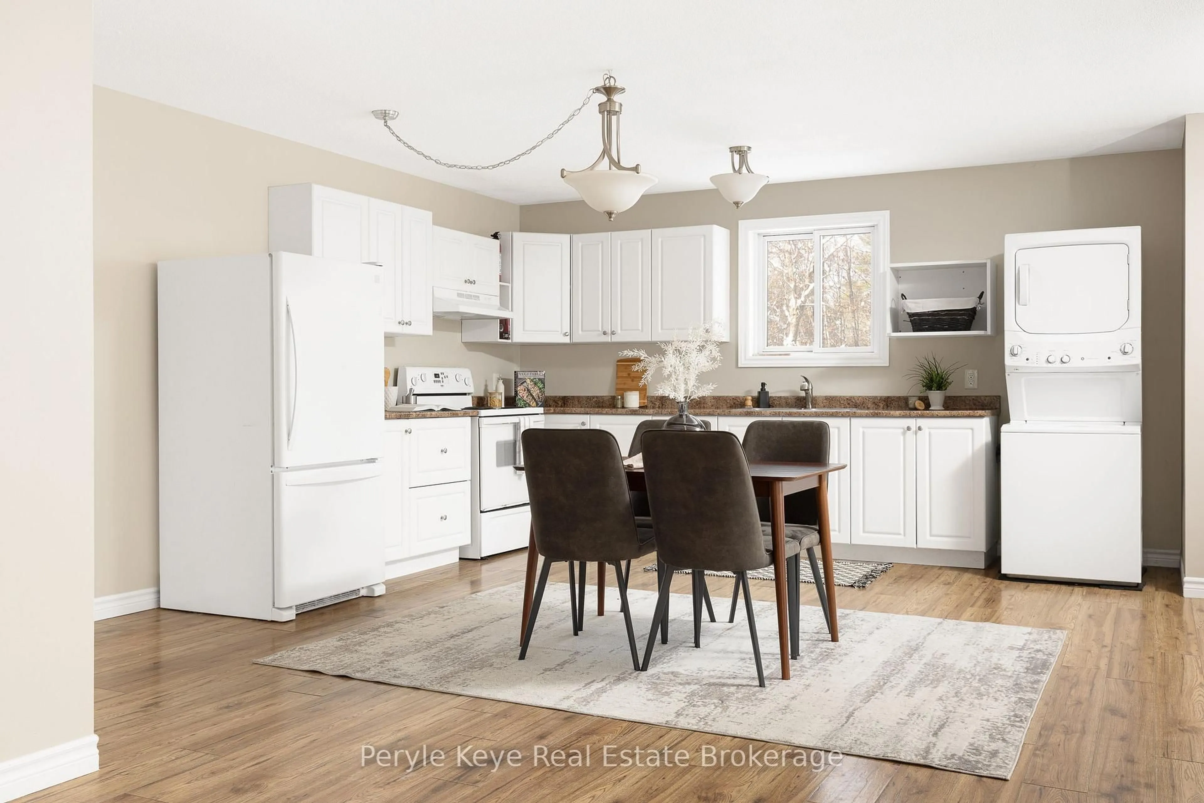 Open concept kitchen, wood/laminate floor for 820 Manitoba St, Bracebridge Ontario P1L 1W9