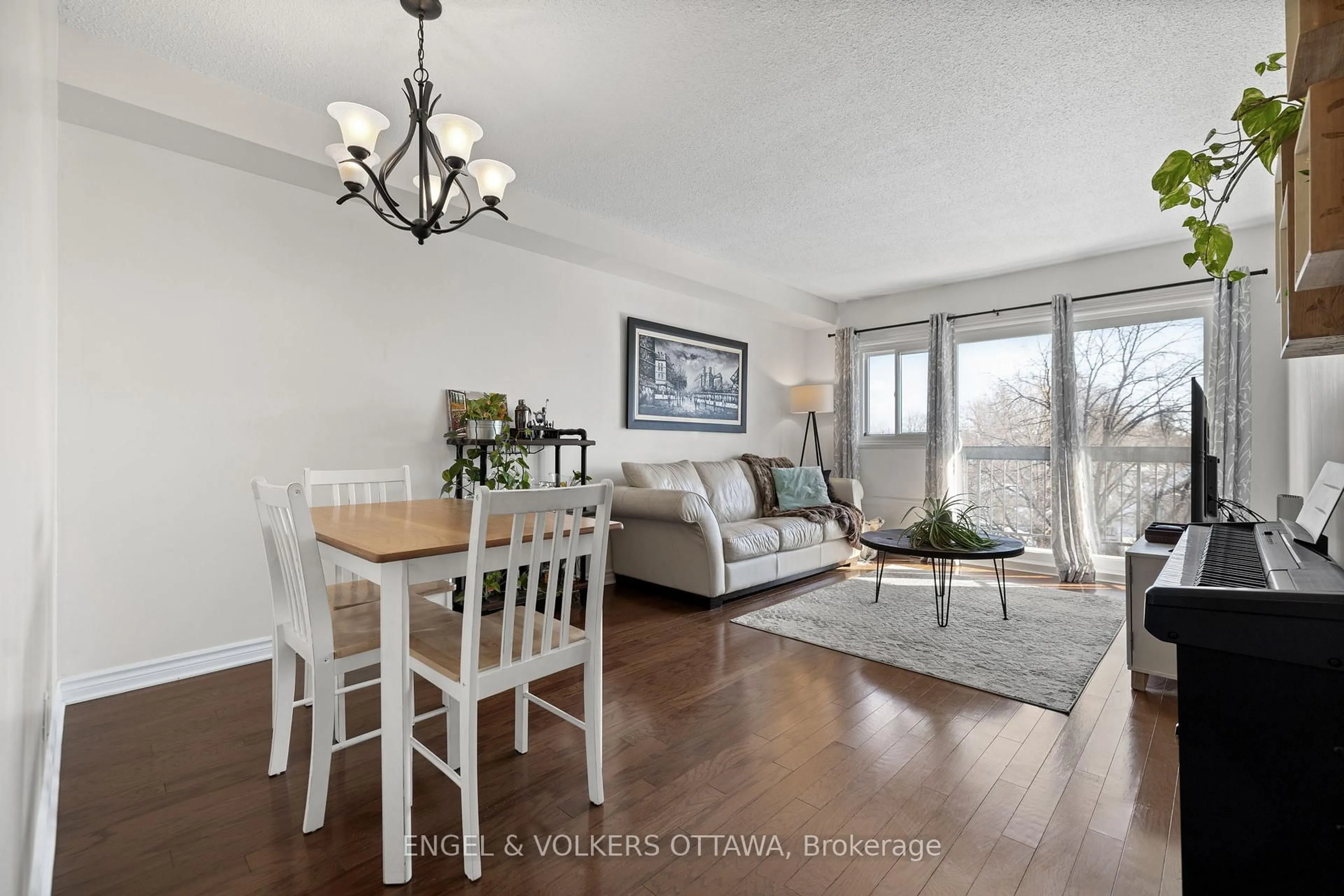 Living room with furniture, wood/laminate floor for 158A Mcarthur Ave #303, Ottawa Ontario K1L 7E7